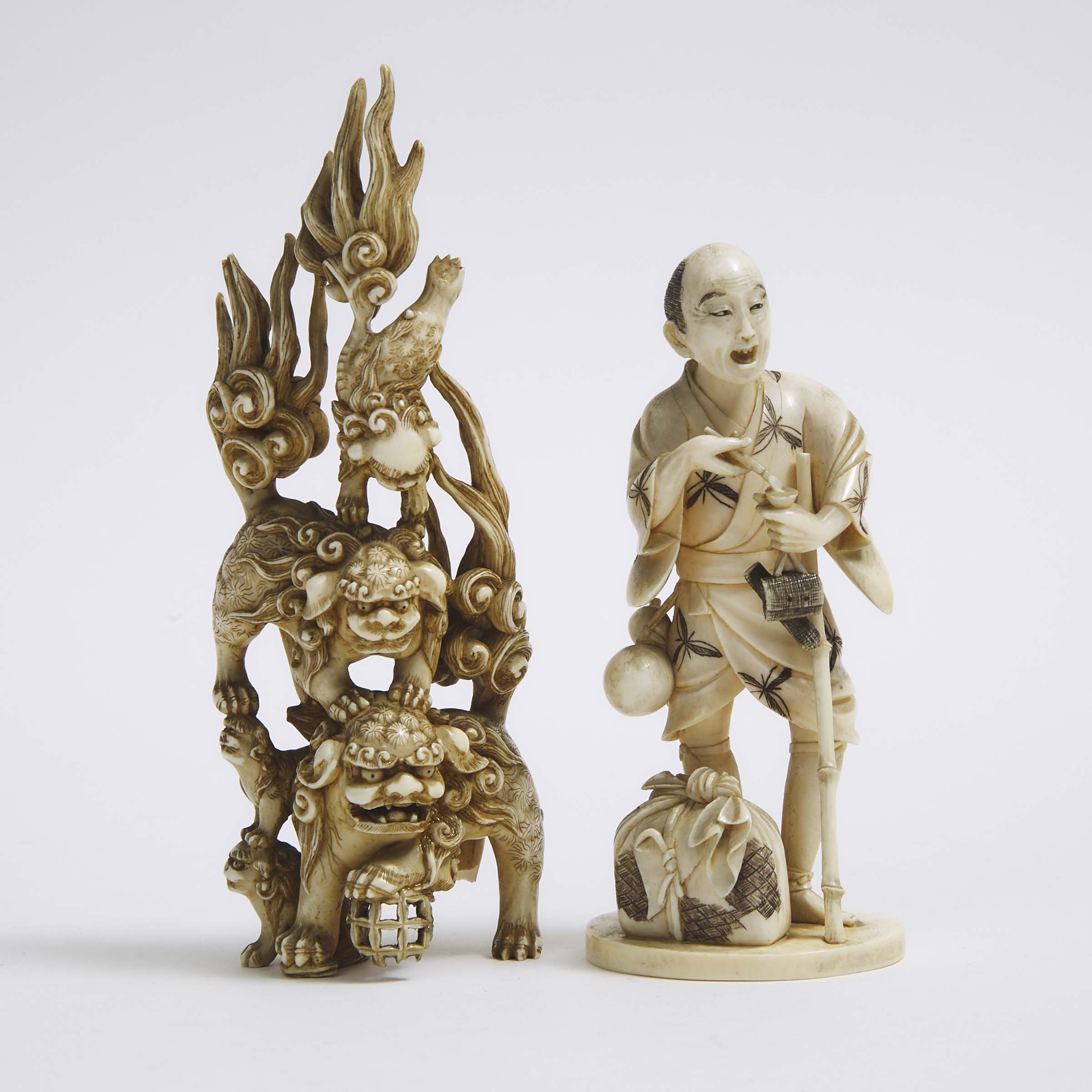 Two Ivory Okimono of Shishis and a Standing Man, Meiji Period