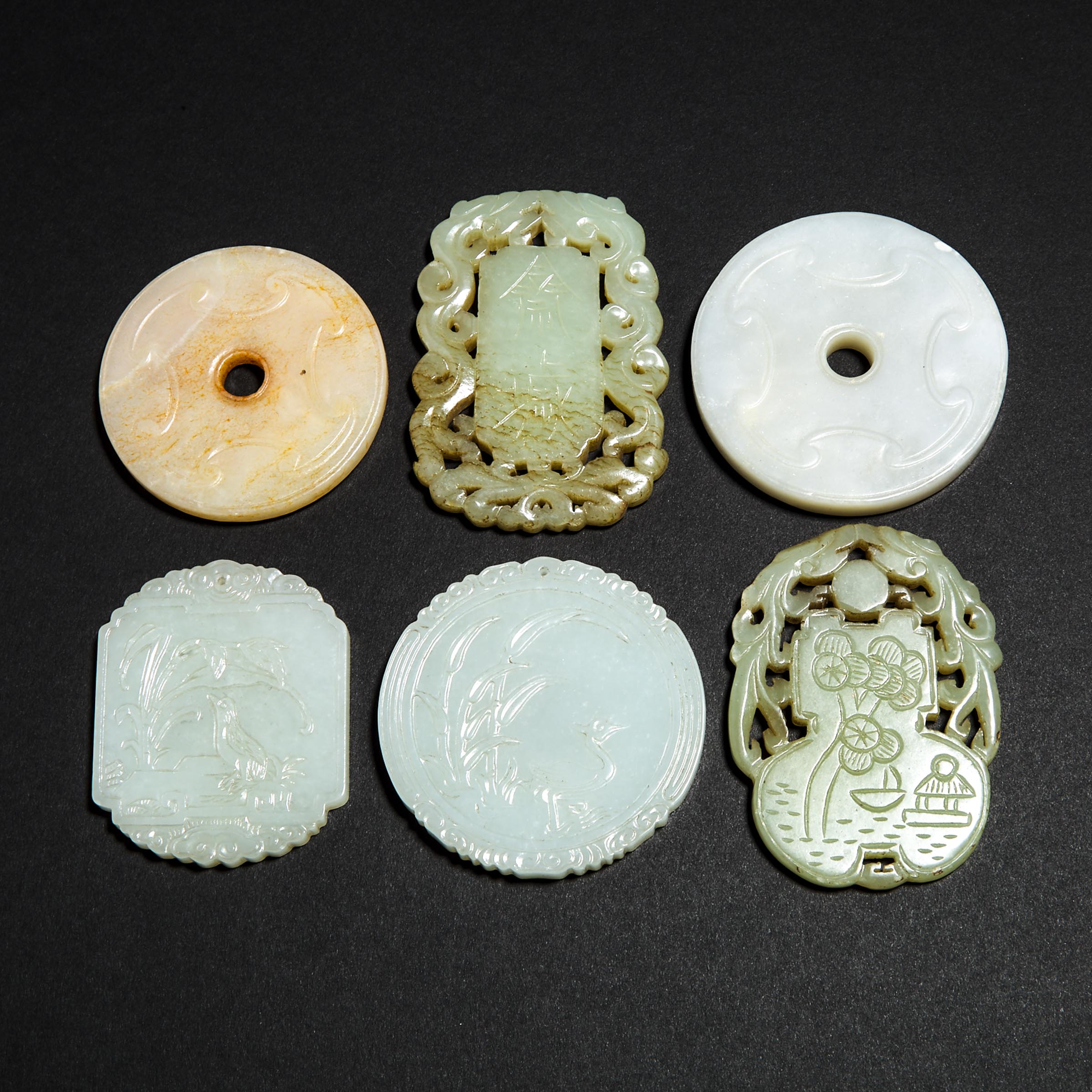 A Group of Six White and Celadon Jade Plaque Pendants