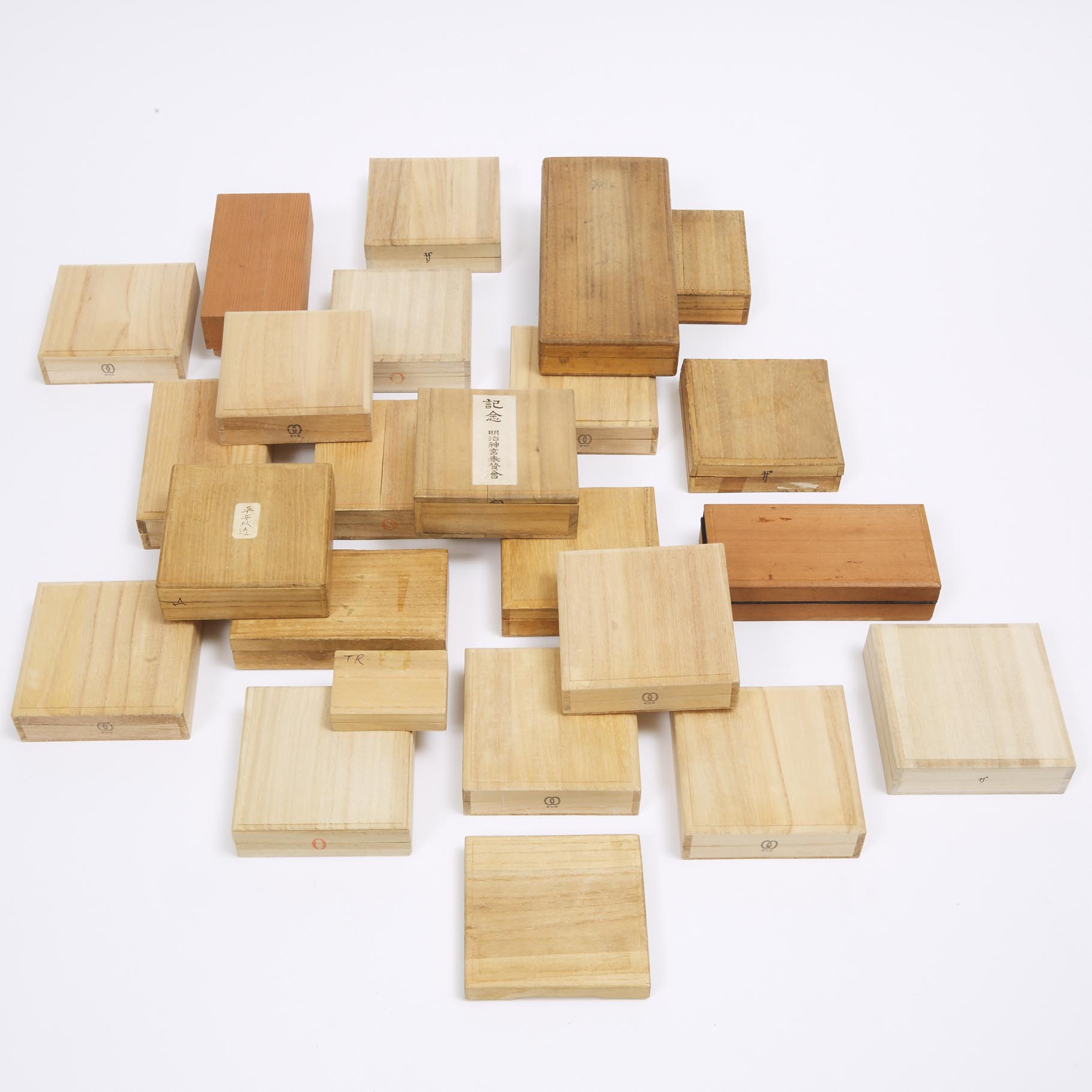 A Group of Twenty-Four Wood Tsuba and Miscellaneous Boxes