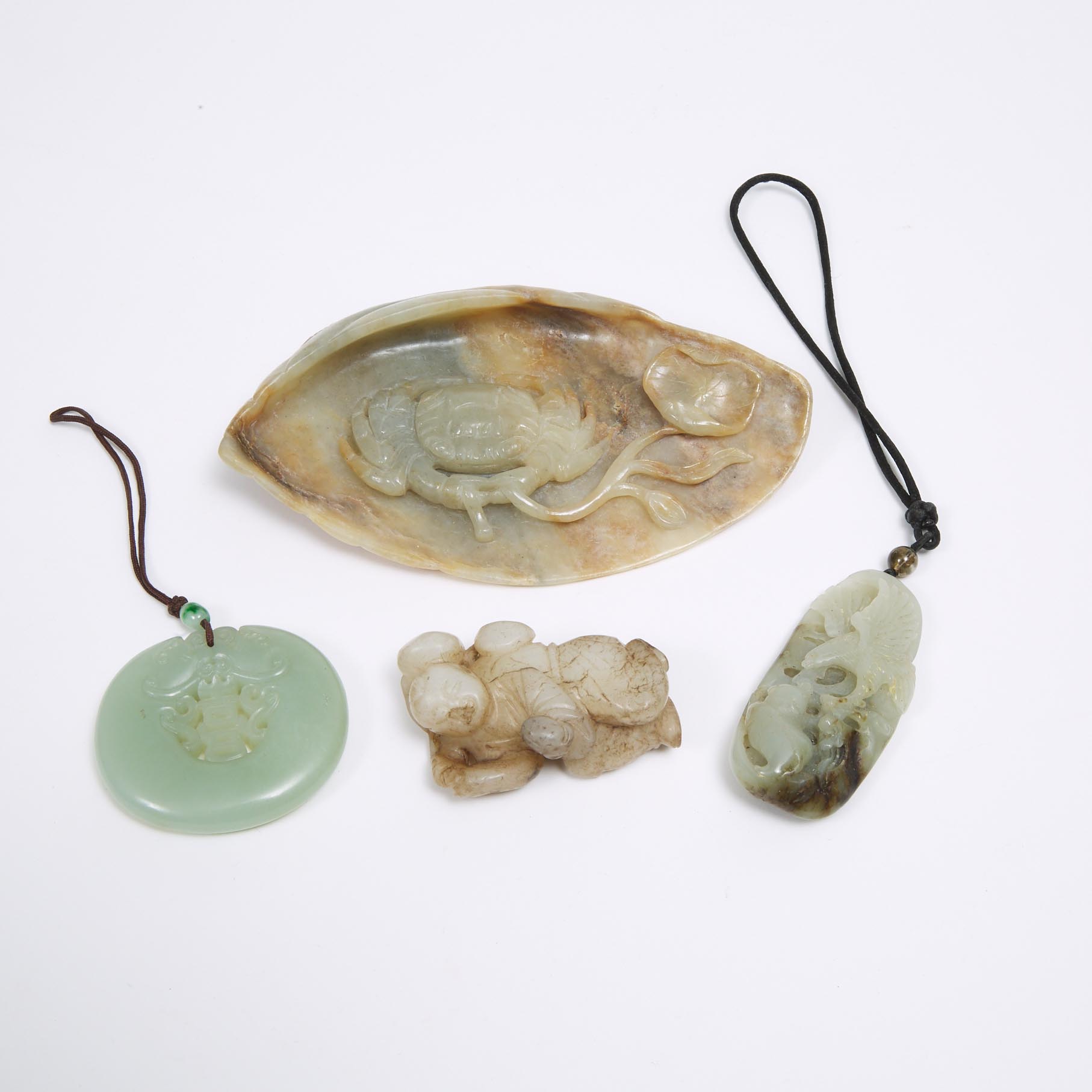 A Group of Four Jade and Hardstone Carvings