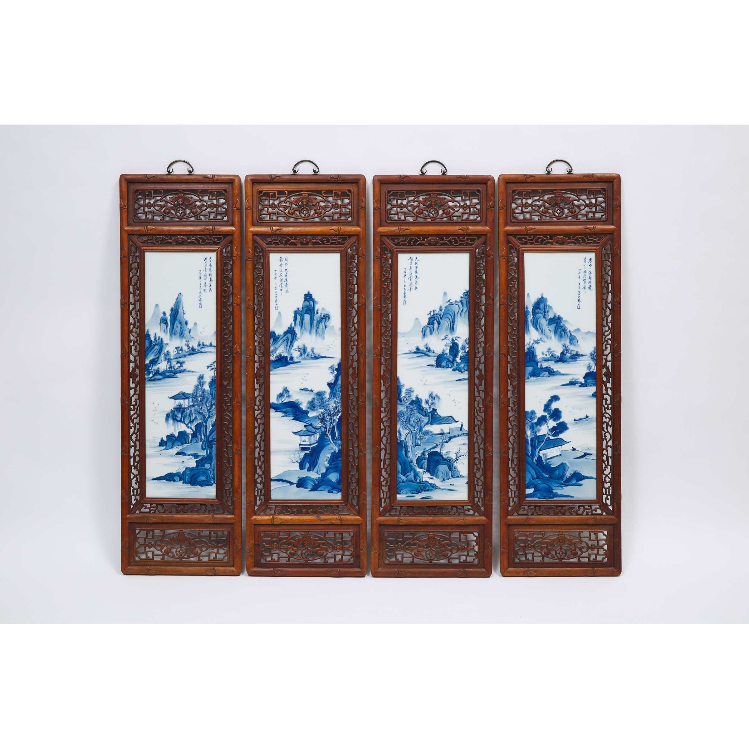 A Set of Four Blue and White Porcelain Inlaid Wood Panels