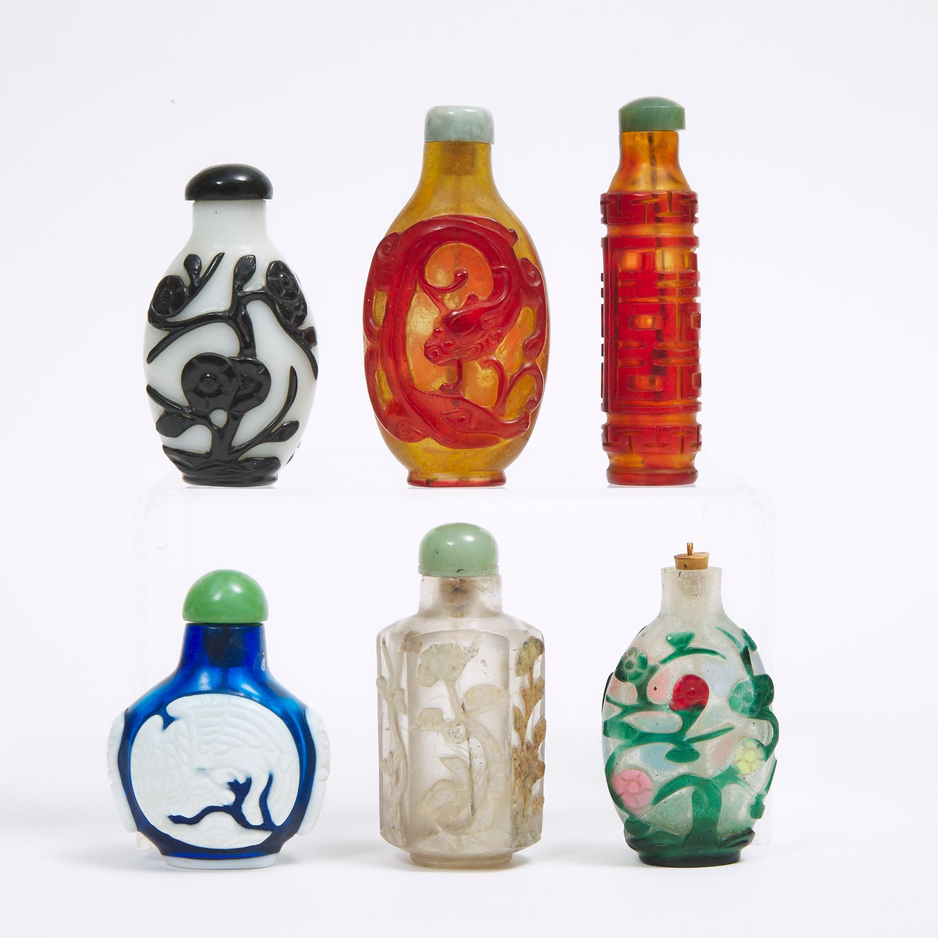 A Group of Five Overlay Glass Snuff Bottles, together with a Faceted Rock Crystal Snuff Bottle