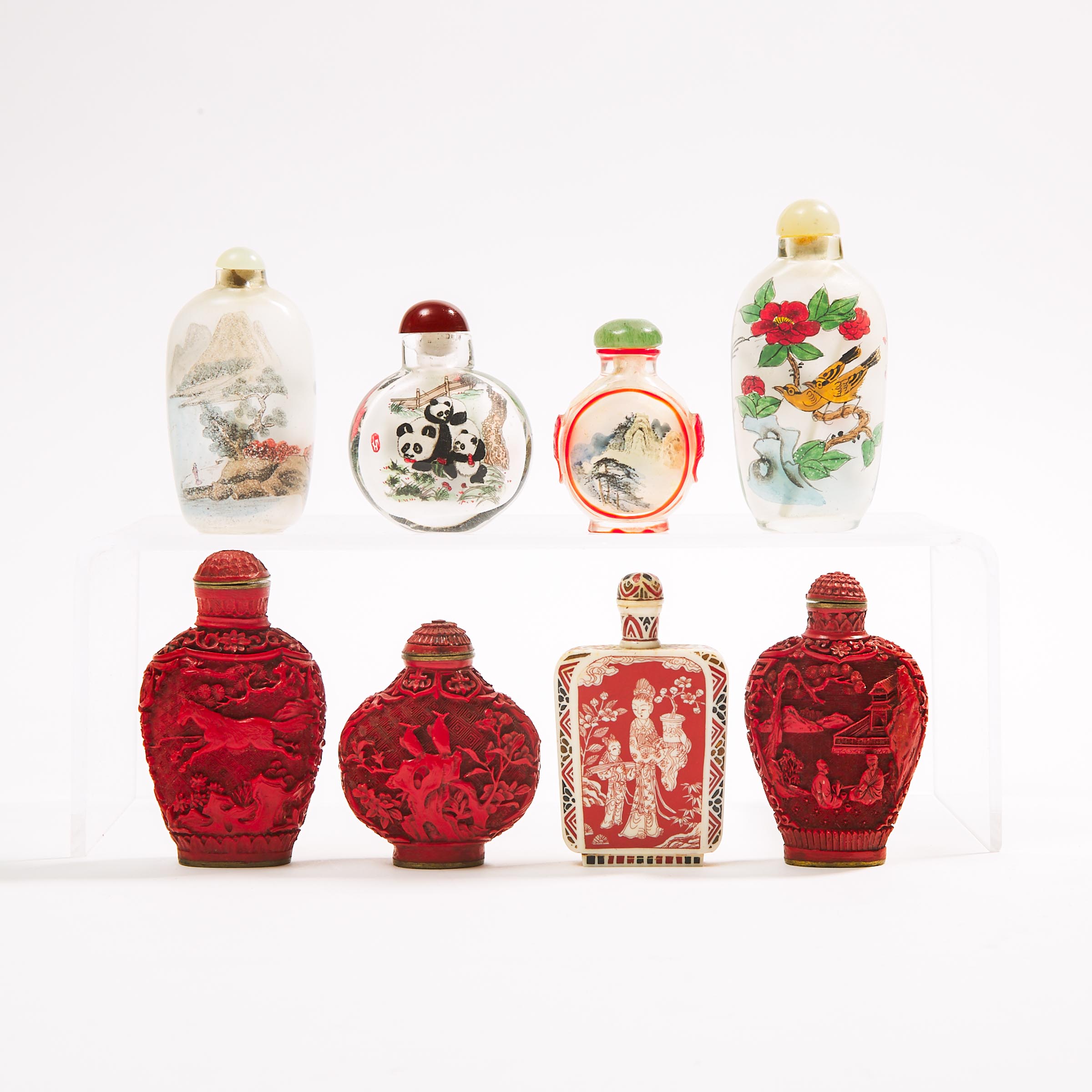 A Group of Eight Glass, Ivory, and Resin Snuff Bottles