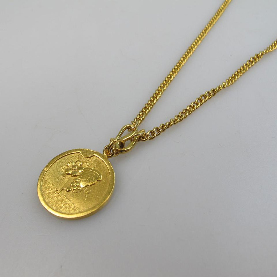 High Carat Yellow Gold Curb Link Chain And Medallion Pendant