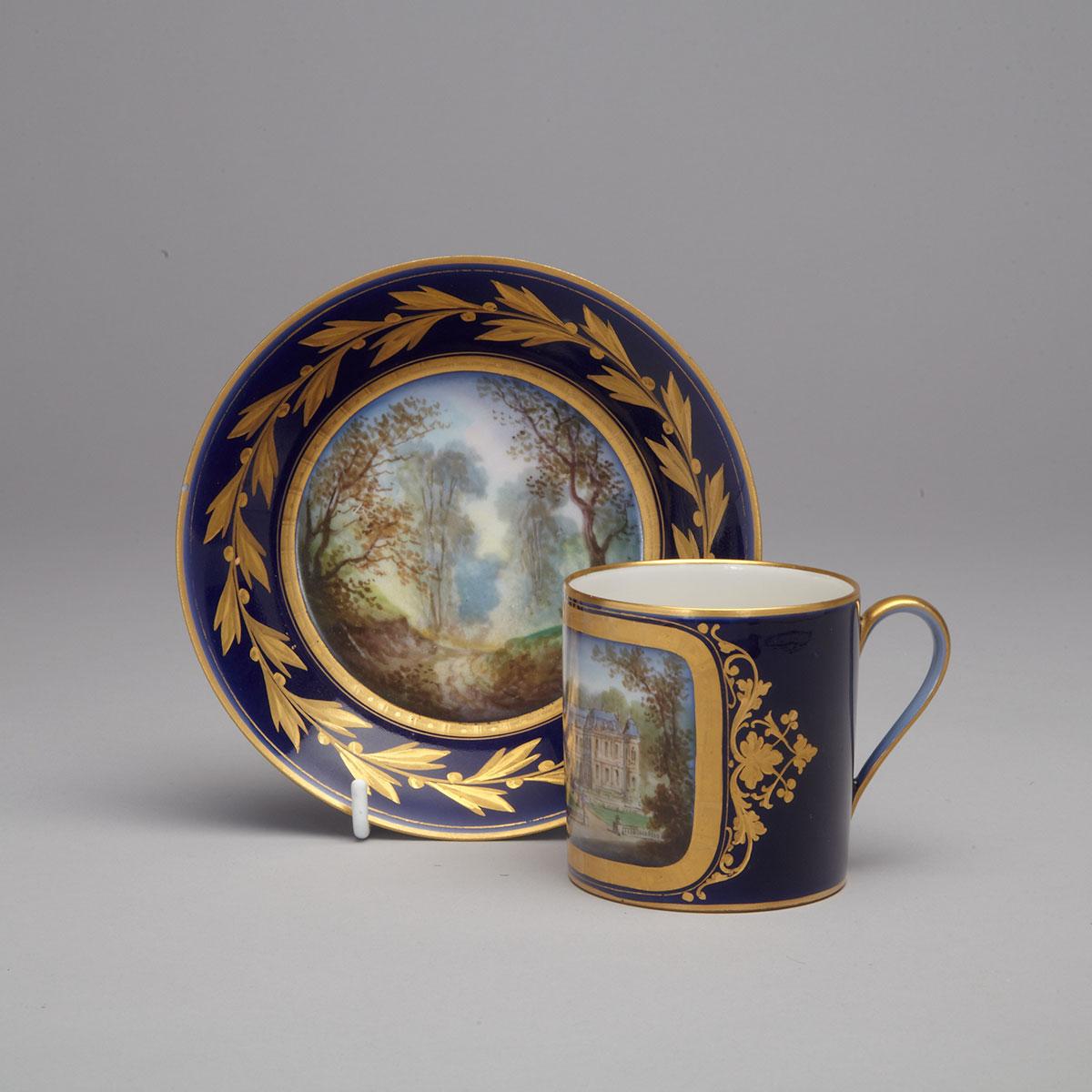 ‘Sèvres’ Blue and Gilt Ground Topographical Coffee Can and Saucer, late 19th century