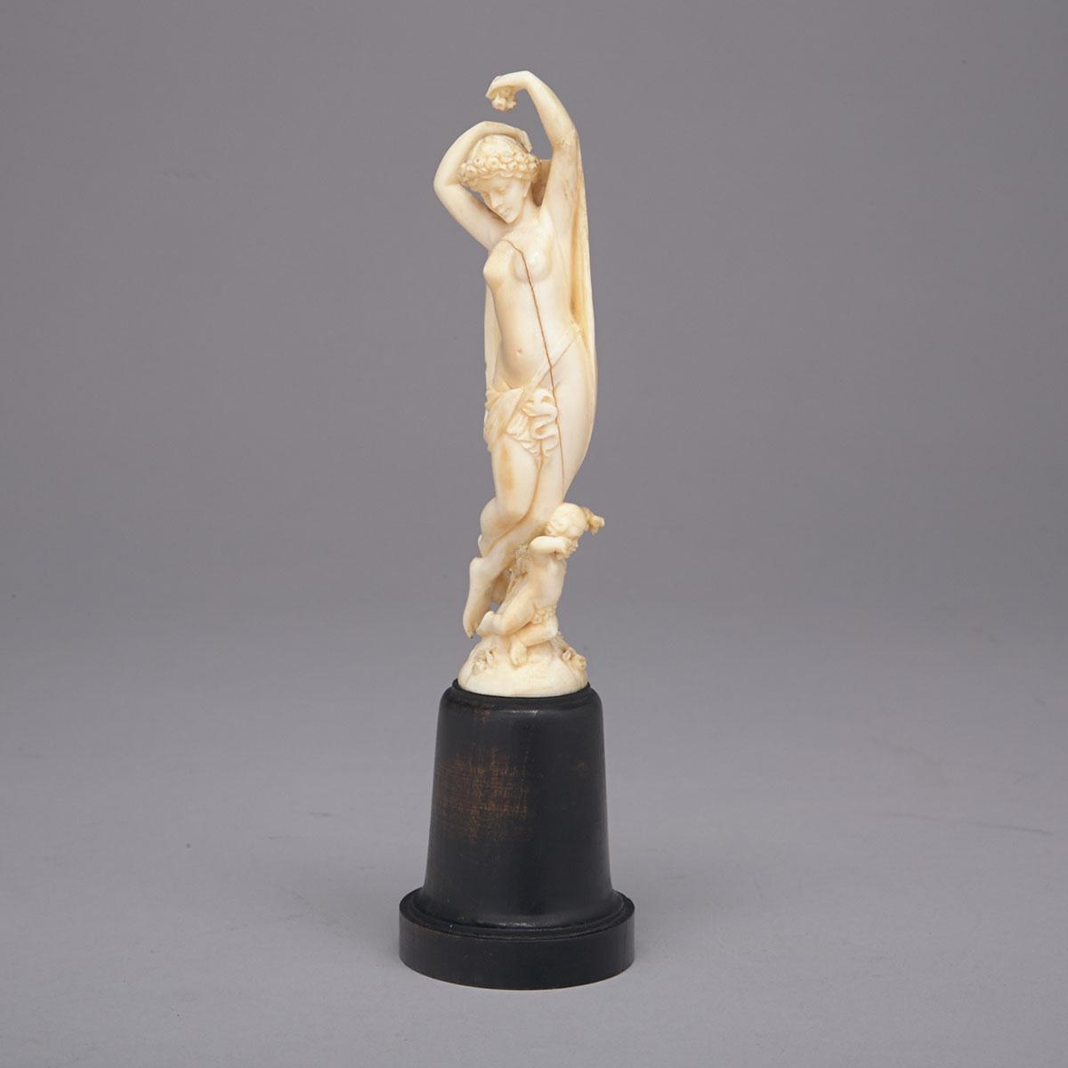 Small Continental Carved Ivory Group of a Classical Nude and Cherub, 19th century