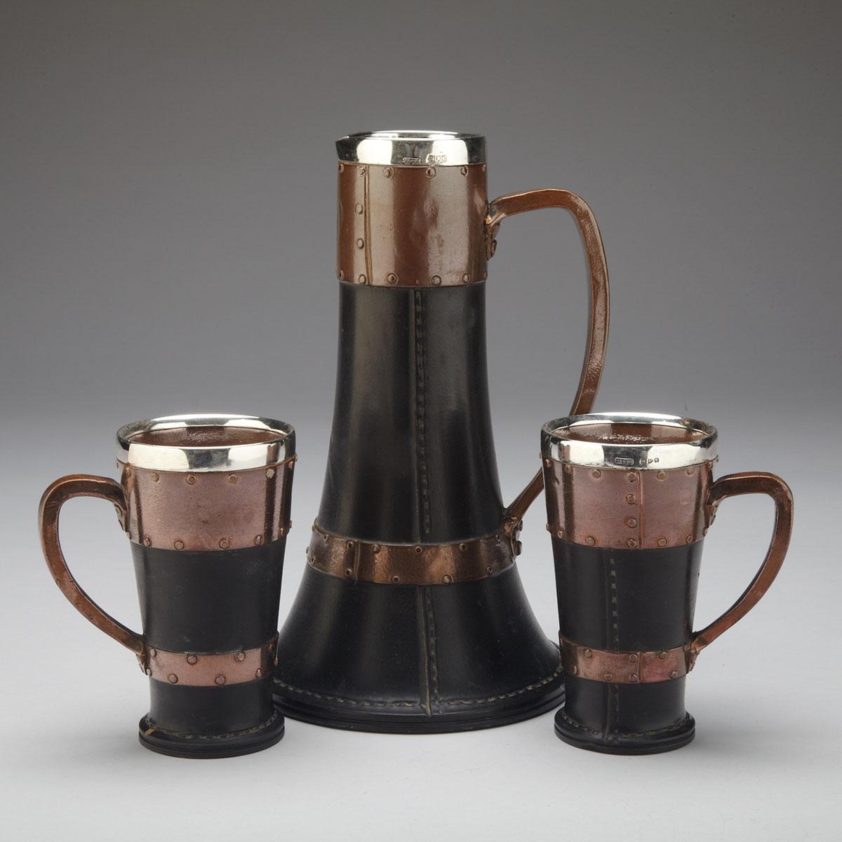 Doulton Lambeth ‘Silicon’ Simulated Leather and Copper Jug and a Pair of Mugs, c.1898-99