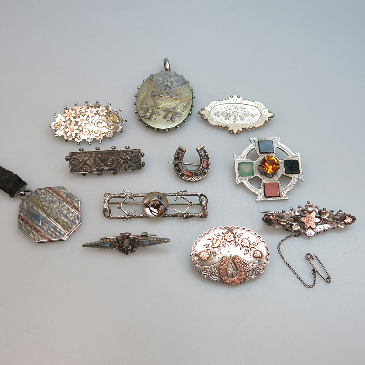 11 Various Silver Pins And Lockets
