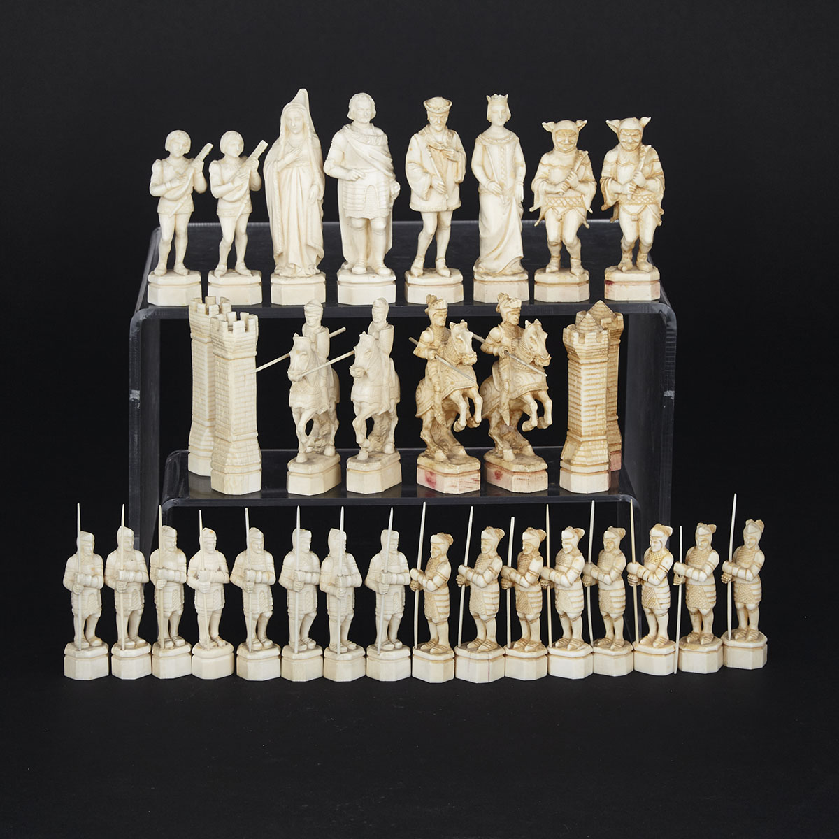 French Carved Ivory ‘Medieval’ Style Figural Chess Set, 19th century