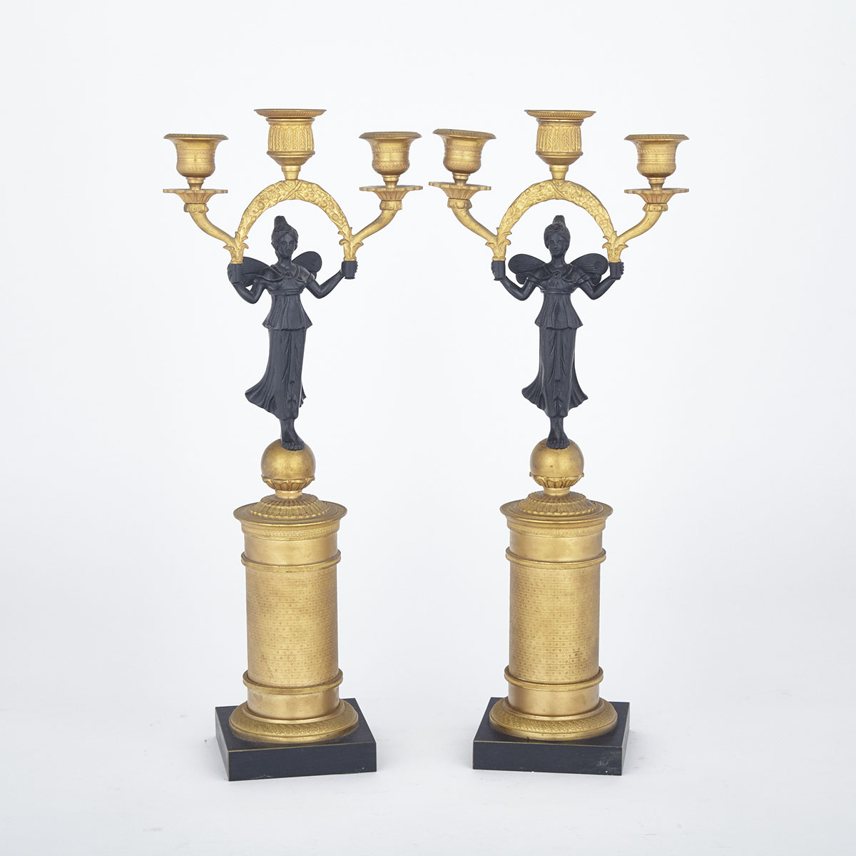 Pair of French Empire Style Gilt and Patinated Bronze Figural Three Light Candelabra, mid 20th century