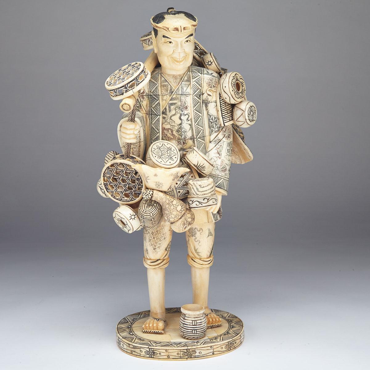 Large Tinted Pieced-Bone Okimono of a Basket Peddler