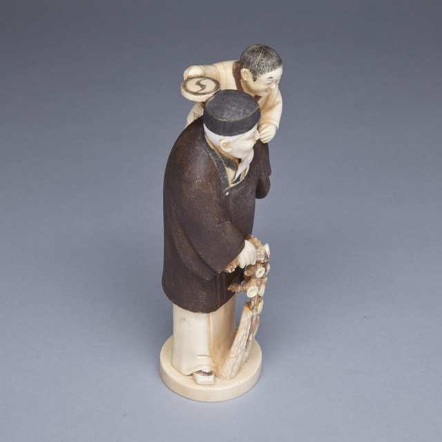 Ivory Carved Okimono of a Father and Son, Signed, Meiji Period, Late 19th Century