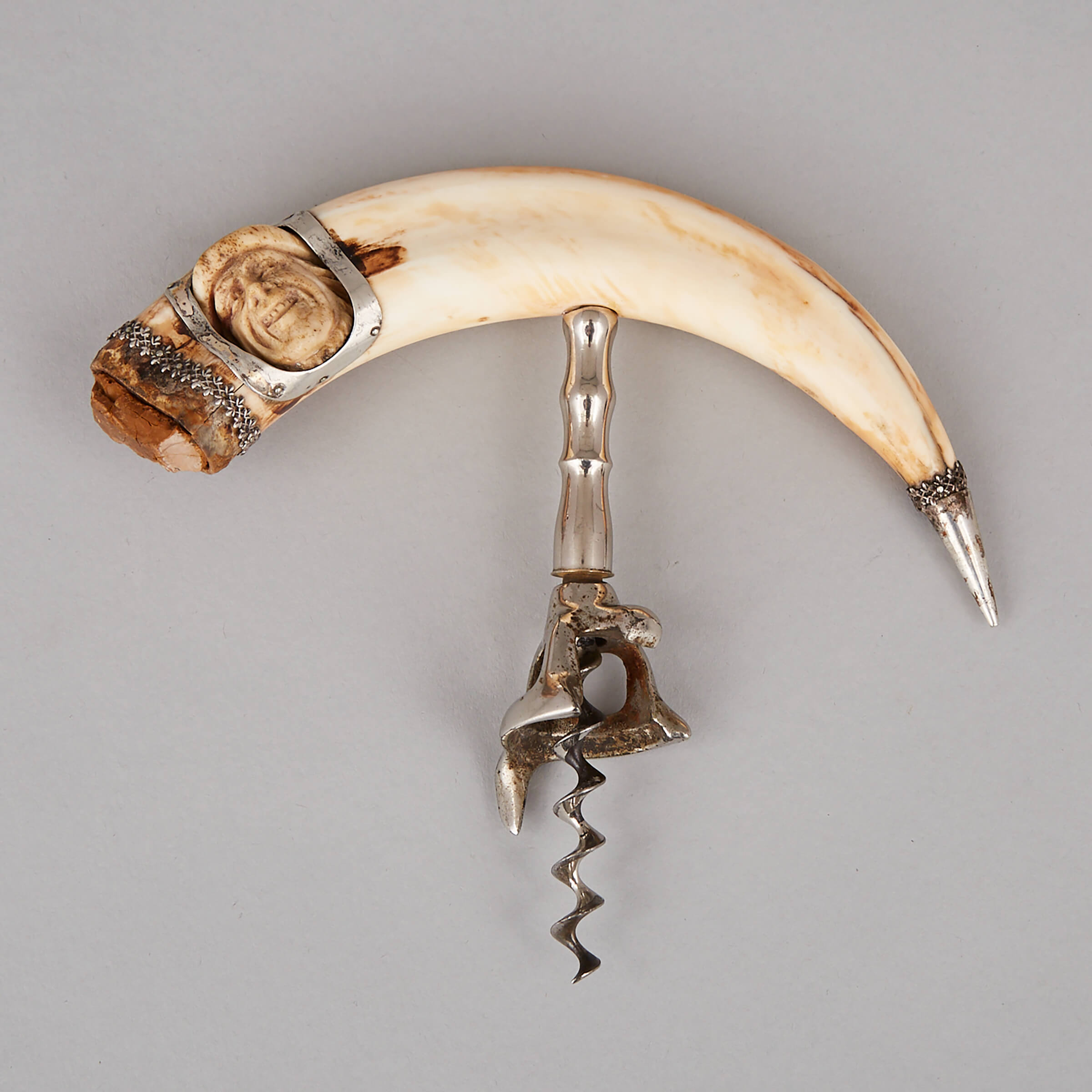 Victorian Silver Mounted Boar Tusk Corkscrew with Inset Carved Bone Articulated Head, c.1900