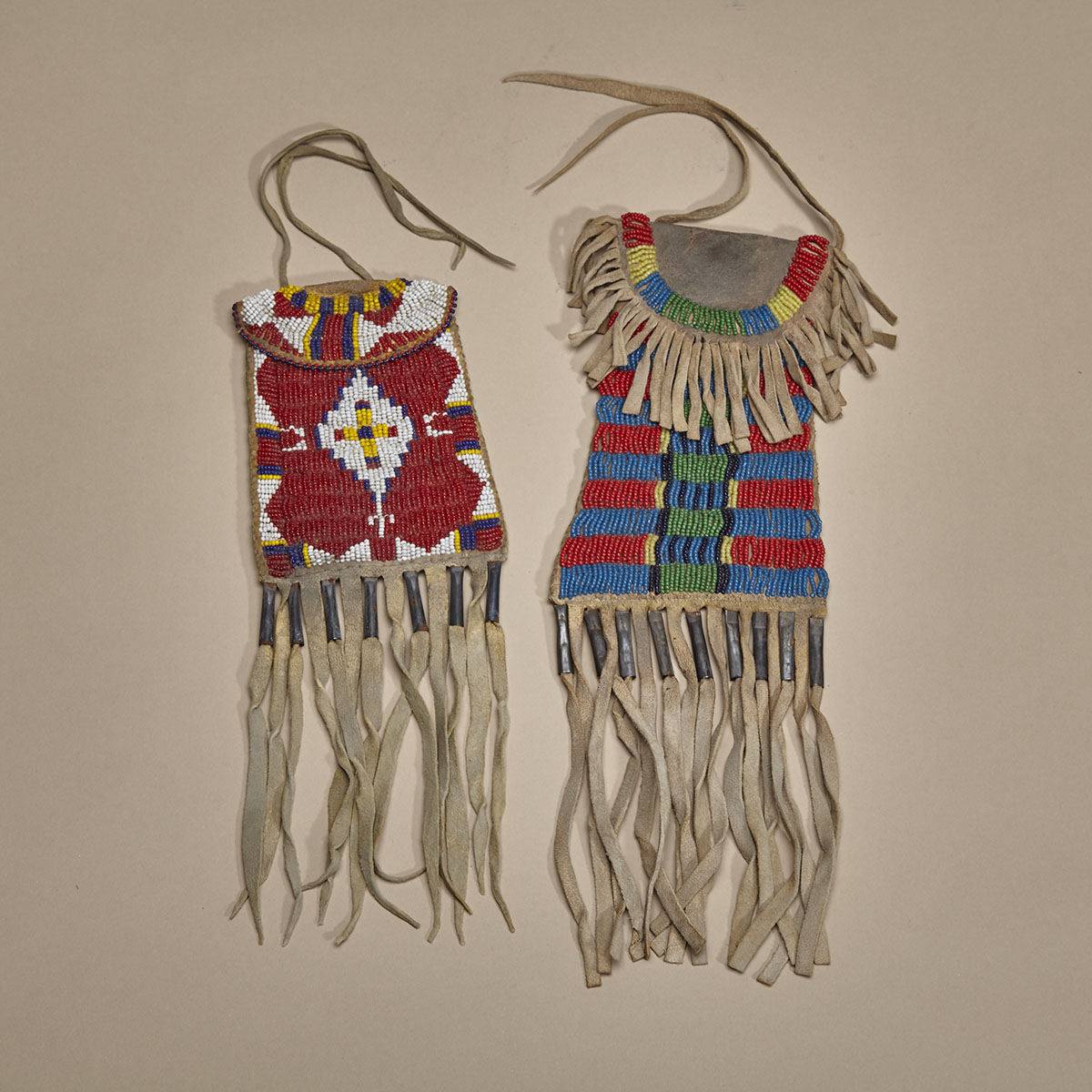 TWO PLAINS STRIKE-A-LITE BEADED BAGS AND A BEADED POUCH