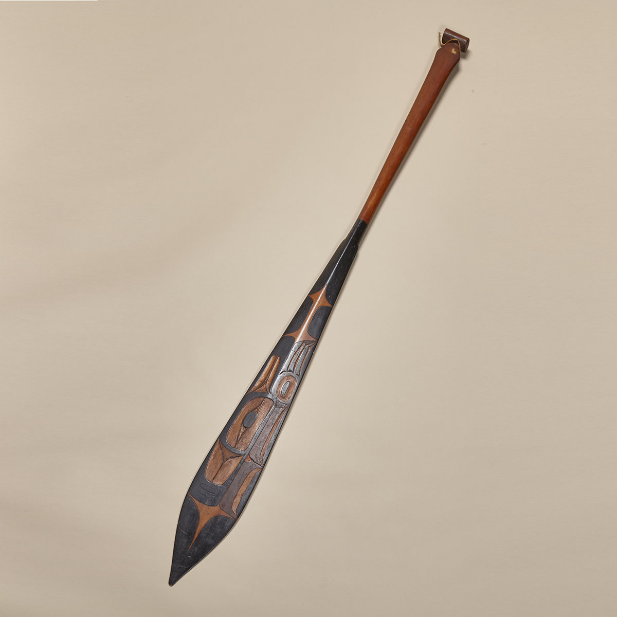 TSIMSHIAN CARVED AND POLYCHROMED PADDLE