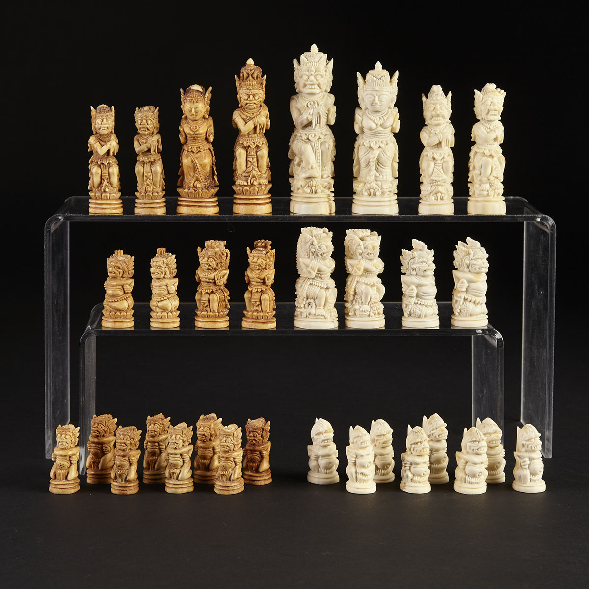 Indonesian Carved Antler Figural ‘Deity’ Chess Set, early 20th century