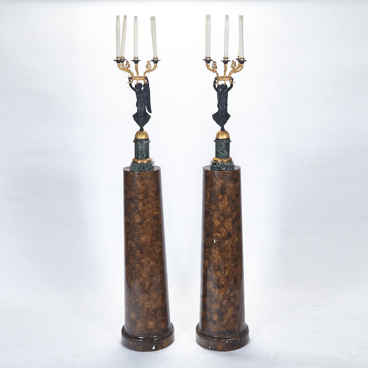 Pair of French Empire Style Gilt and Patinated Bronze Figural Candelabra, on Faux Marble Columns, 20th century