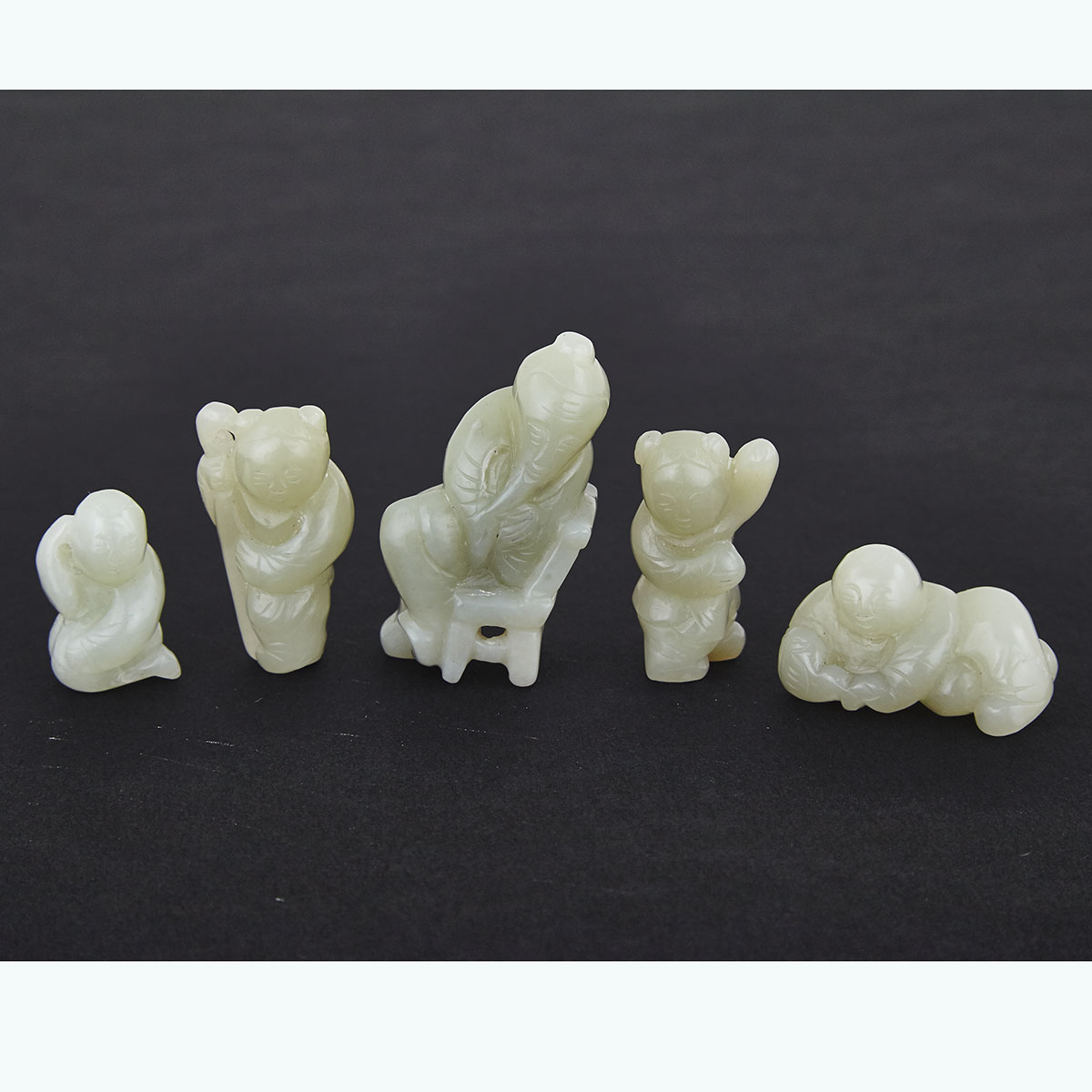 Group of Five Pale Celadon Jade Figural Pebbles, 19th/20th Century