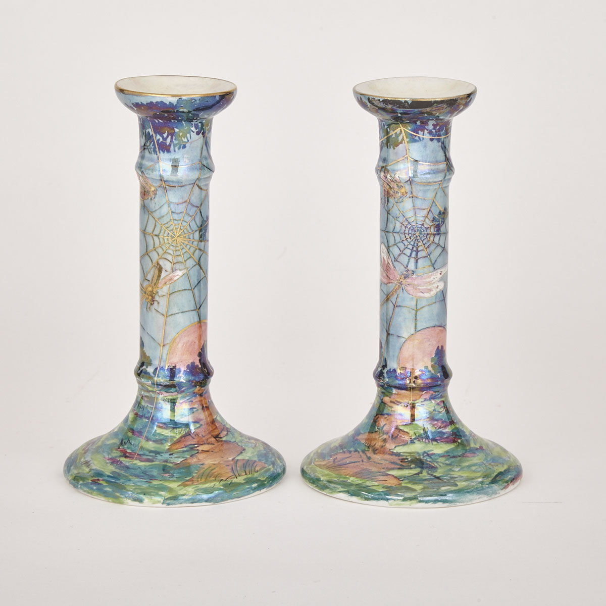 Pair of Grimwades Byzanta Ware Spider Web Pattern Candlesticks, early 20th century