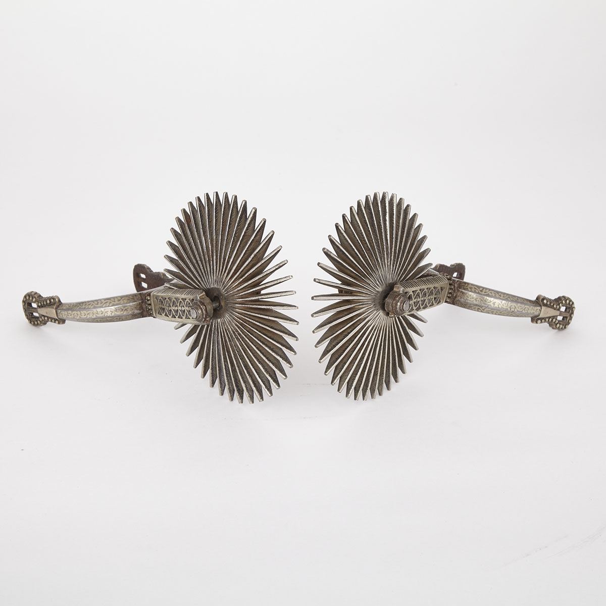 Fine Pair of Argentinean Pampas Polished Steel and Nickel Silver Gaucho Spurs, 19th century