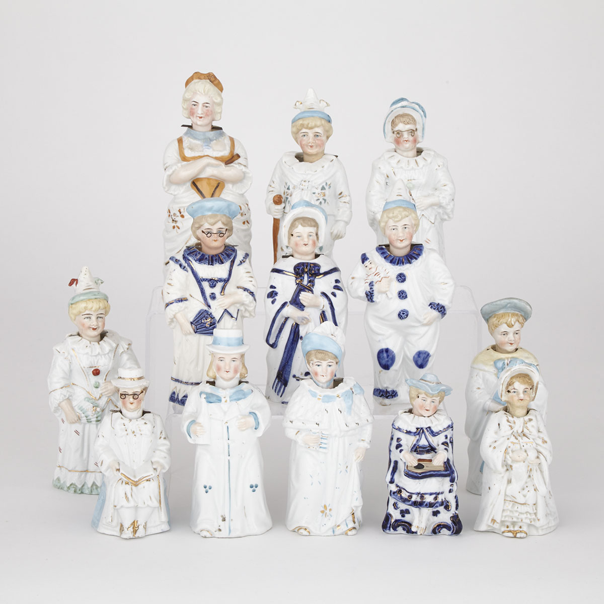 Thirteen Continental Glazed  Porcelain Nodder Figures, late 19th/early 20th century