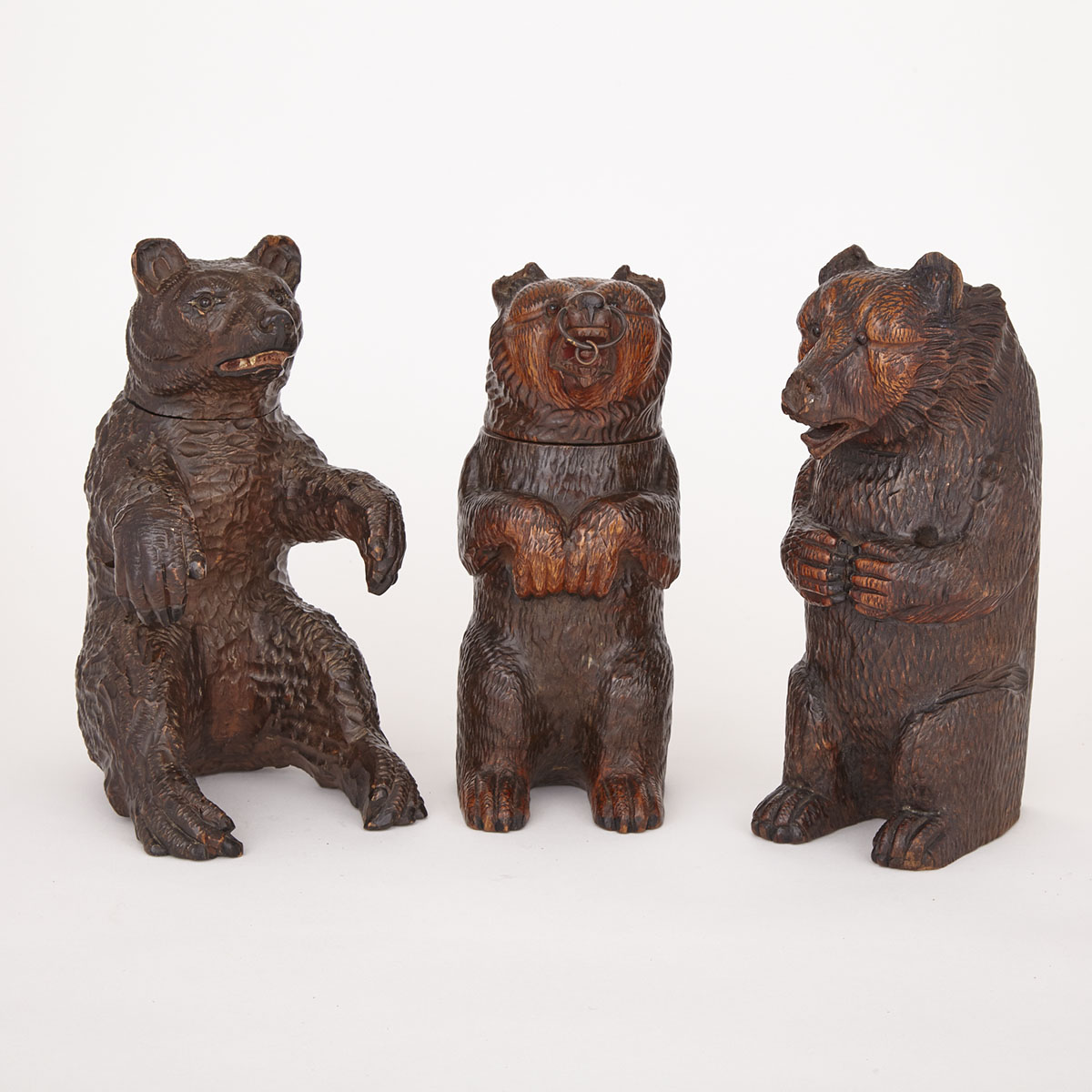 Three Swiss Black Forest Carved Linden Wood Bears, 19th century