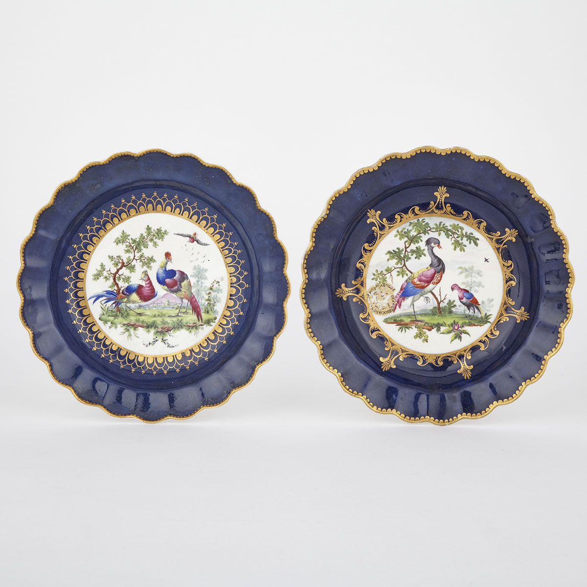 Two Worcester Wet Blue Ground Plates, c.1770