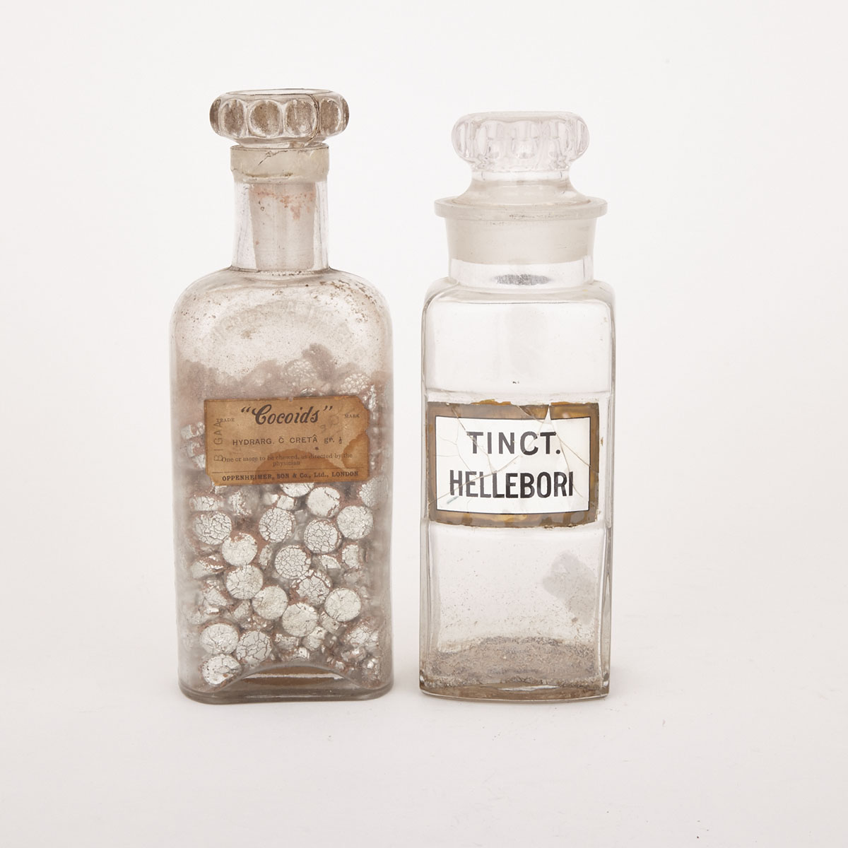 Two Glass Pharmaceutical Bottles,  19th century
