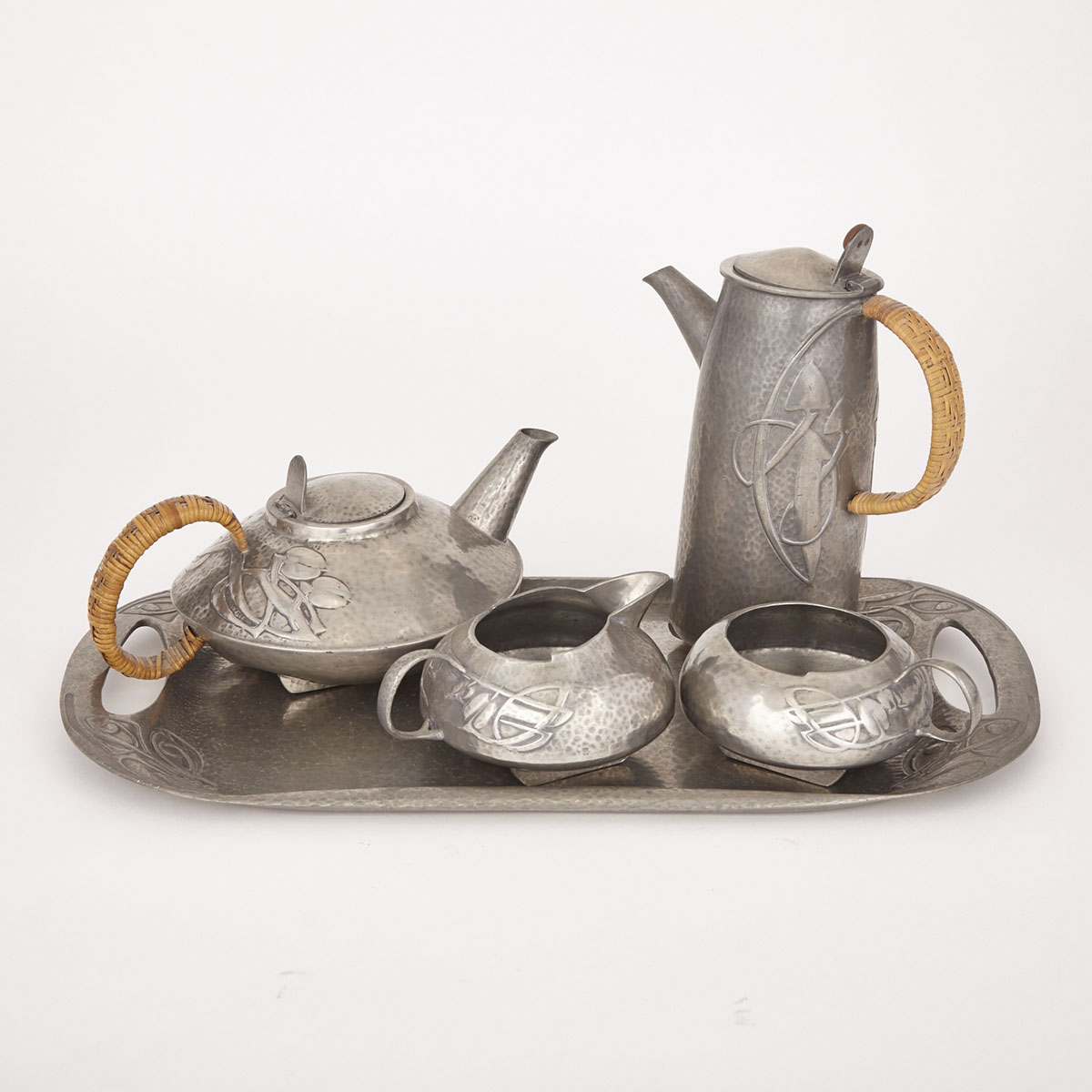 Archibald Knox Five Piece ‘Tudric’ Pewter Tea Service, for Liberty & Co., early 20th century
