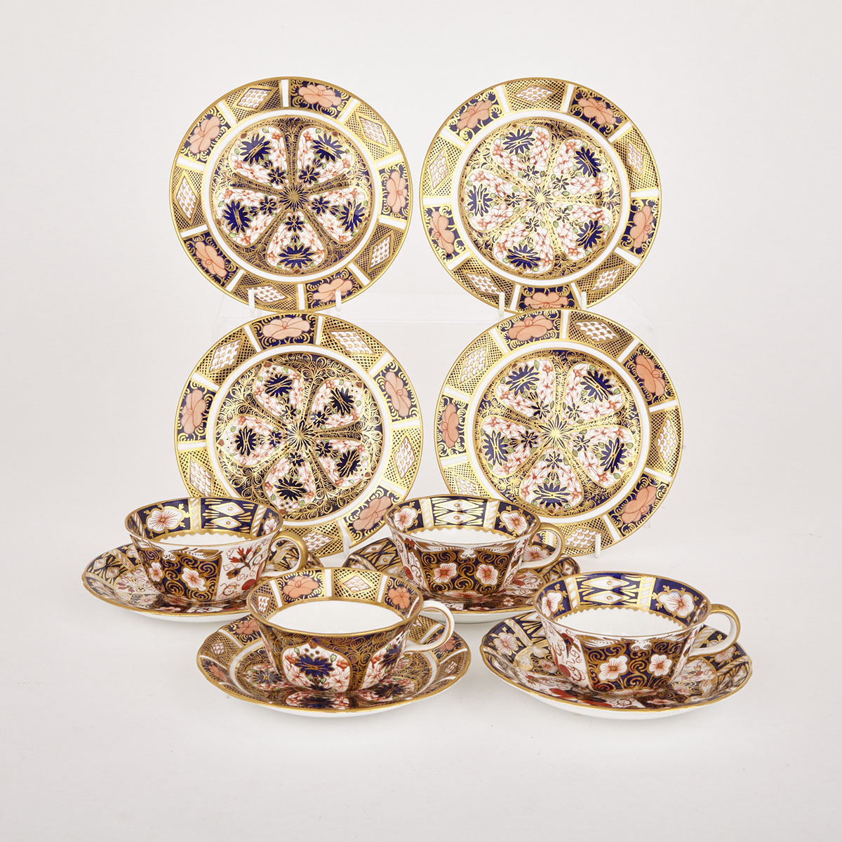 Four Royal Crown Derby ‘Imari’ (2451 and 1128) Pattern Cups and Saucers and Four Side Plates, 20th century