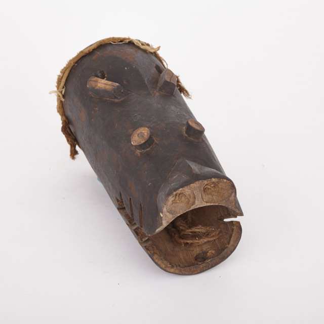 Carved Wood Hippopotamus Mask together with a Carved and Painted Wood Zoomorphic Mask, Africa, 20th century