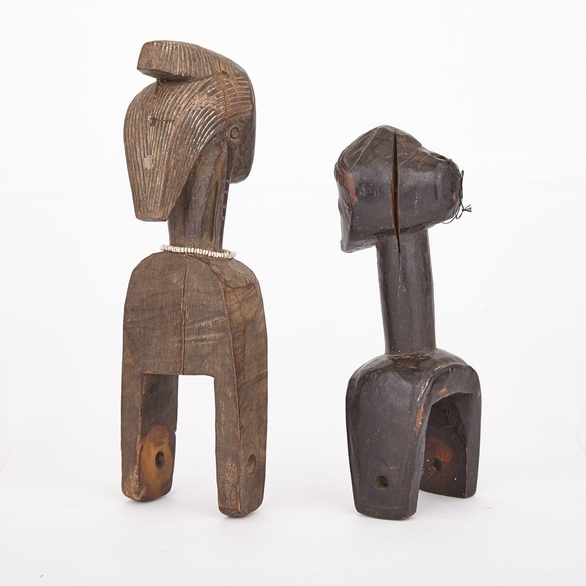 Two Figurative Heddle Pulleys, Africa, both 20th century