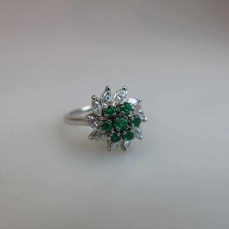 14K White Gold Ring, set with 7 small full cut emeralds encircled by 10 small marquis cut diamonds