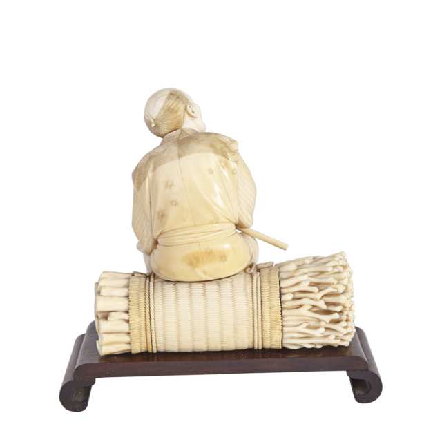 Carved Ivory Okimono of a Woodman, Meiji Period