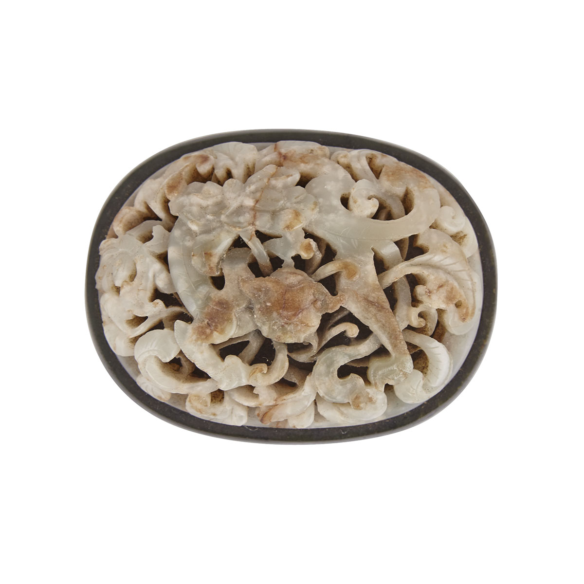 A Rare Pale Celadon and Russet Jade Belt Buckle, Yuen to Ming Dynasty (1279-1644)