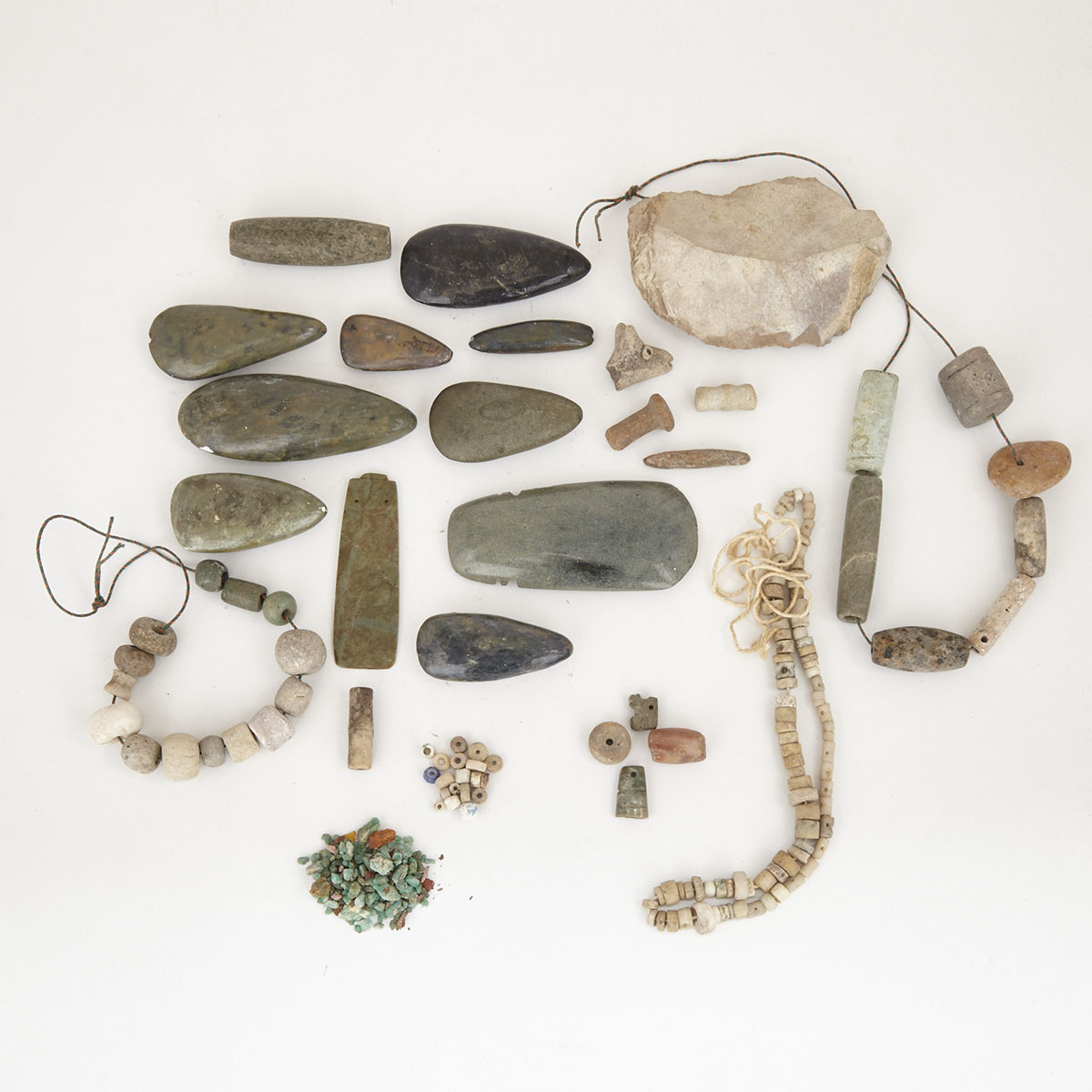 Group of Ceramic and Stone Celts, Celt Pendants and Beads 