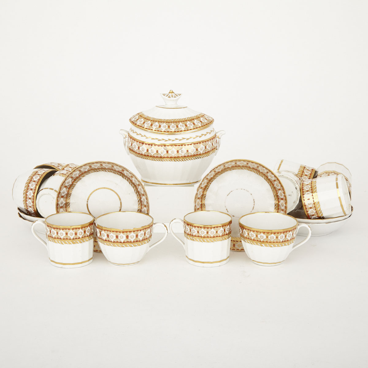 Six Coalport Orange and Gilt Fluted Trios and a Covered Sucrier, c.1810