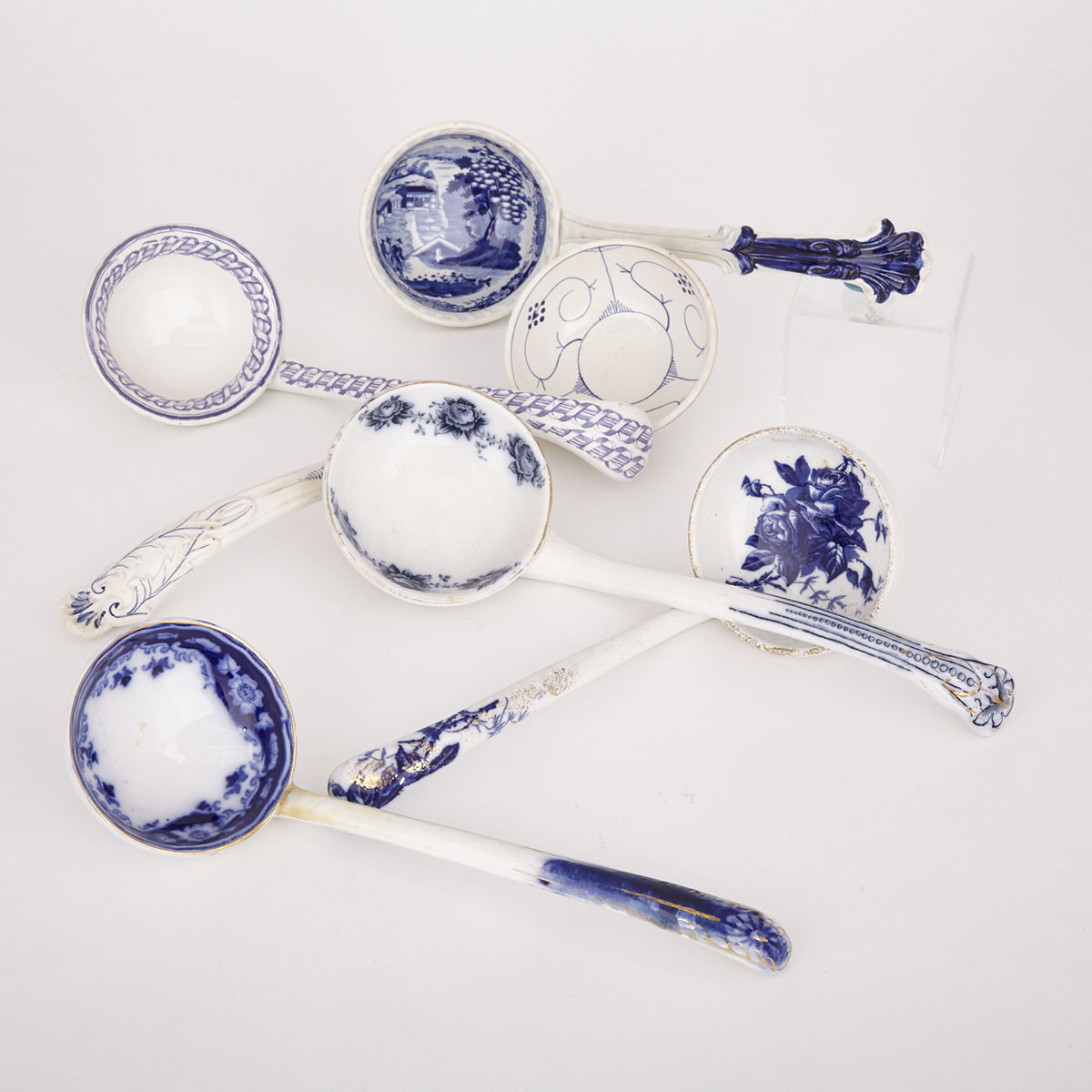 Six Various Blue Decorated Earthenware Soup Ladles, 19th century