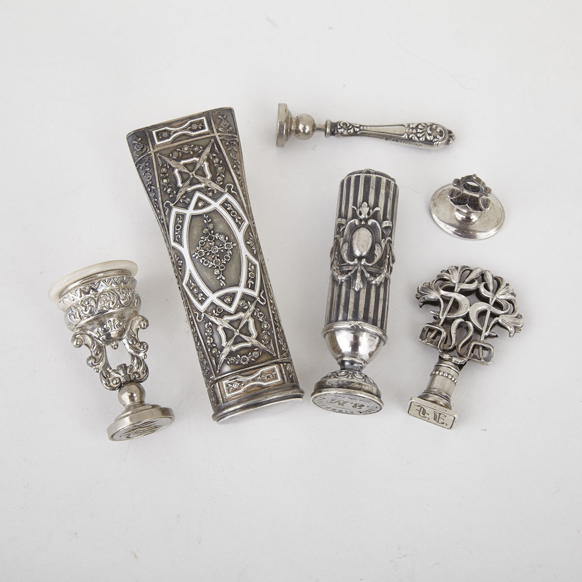 Group of Five Silver and Silvered Metal Desk Seals and a Stamp Roller, c.1900