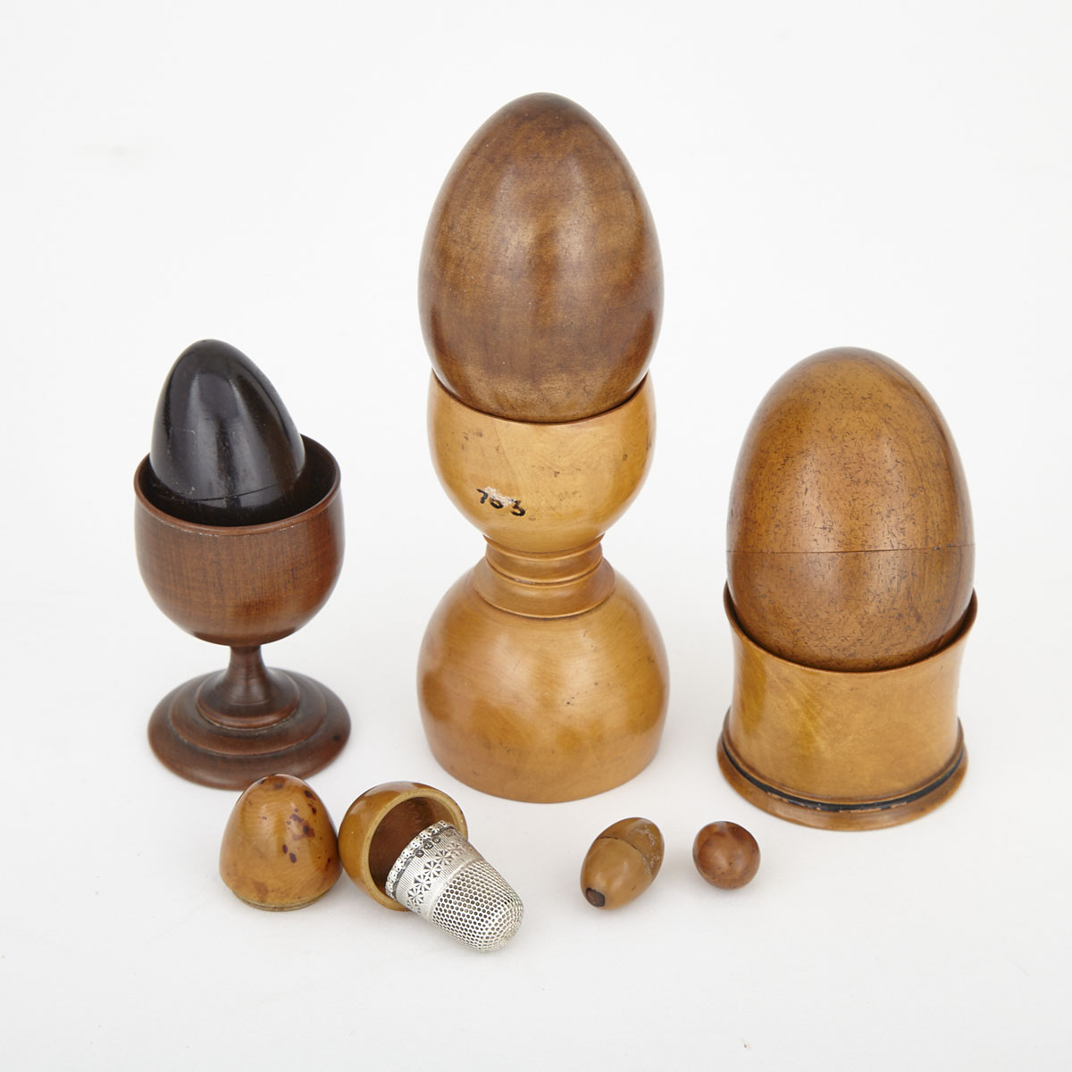 Collection of Treen Form Egg Form Containers and Egg Cups, 19th century