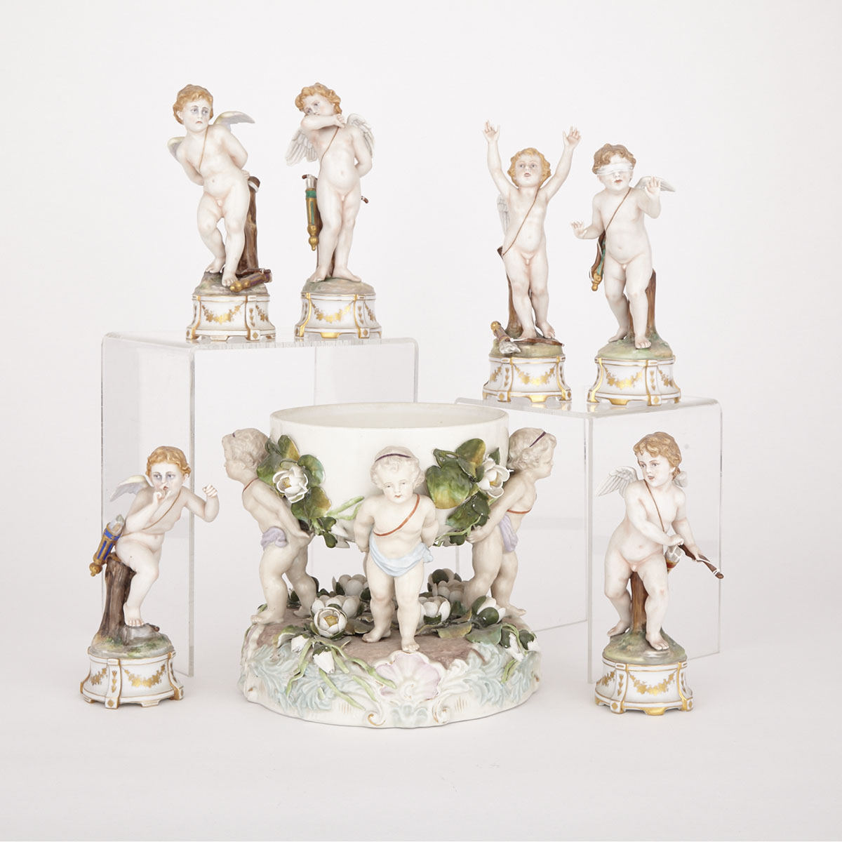 German Porcelain Centrepiece and Six ‘Naples’ Cherub Figurines, late 19th/early 20th century