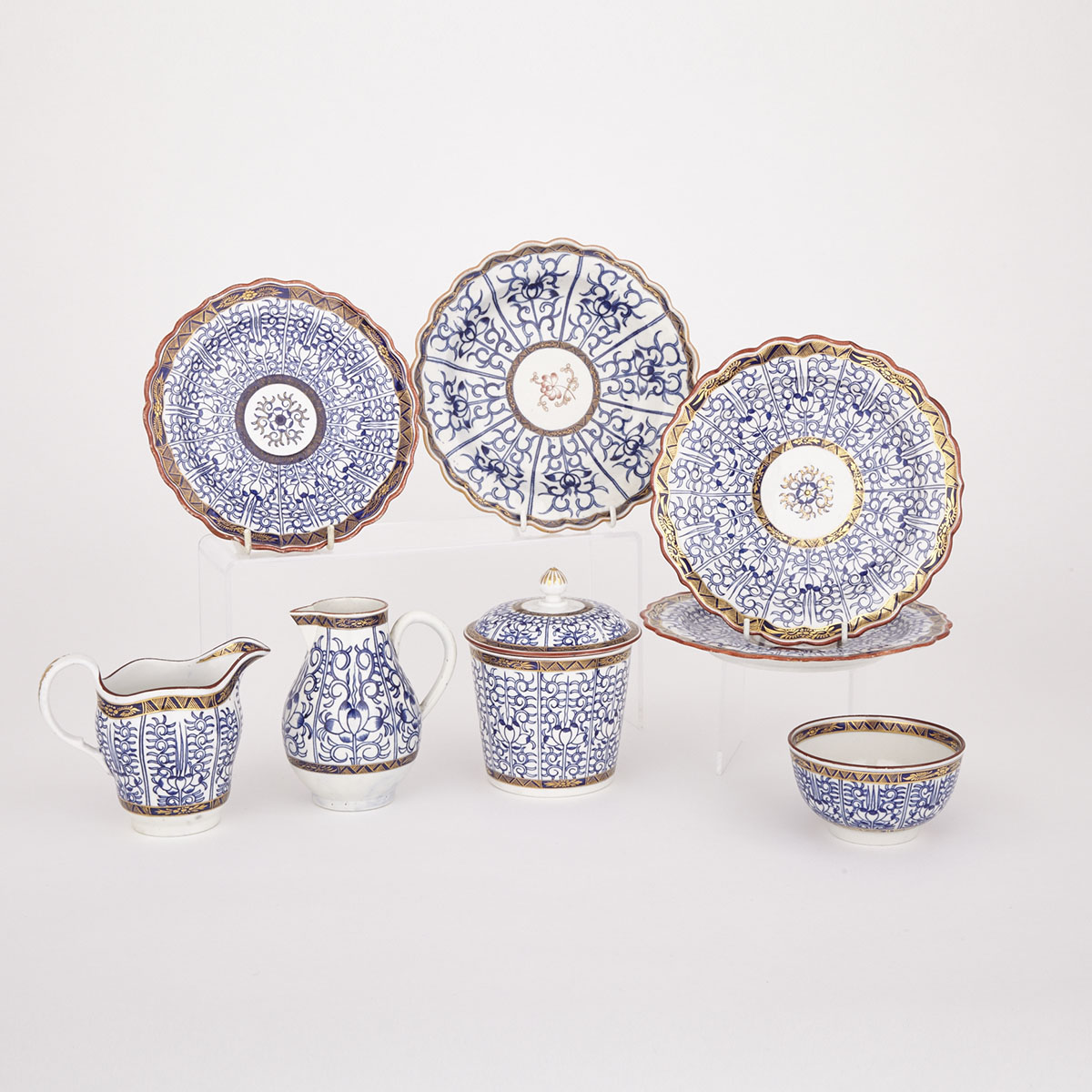 Worcester ‘Royal Lily’ Milk Jug, Cream Jug, Covered Canister, Sugar Bowl and Four Plates, late 18th century
