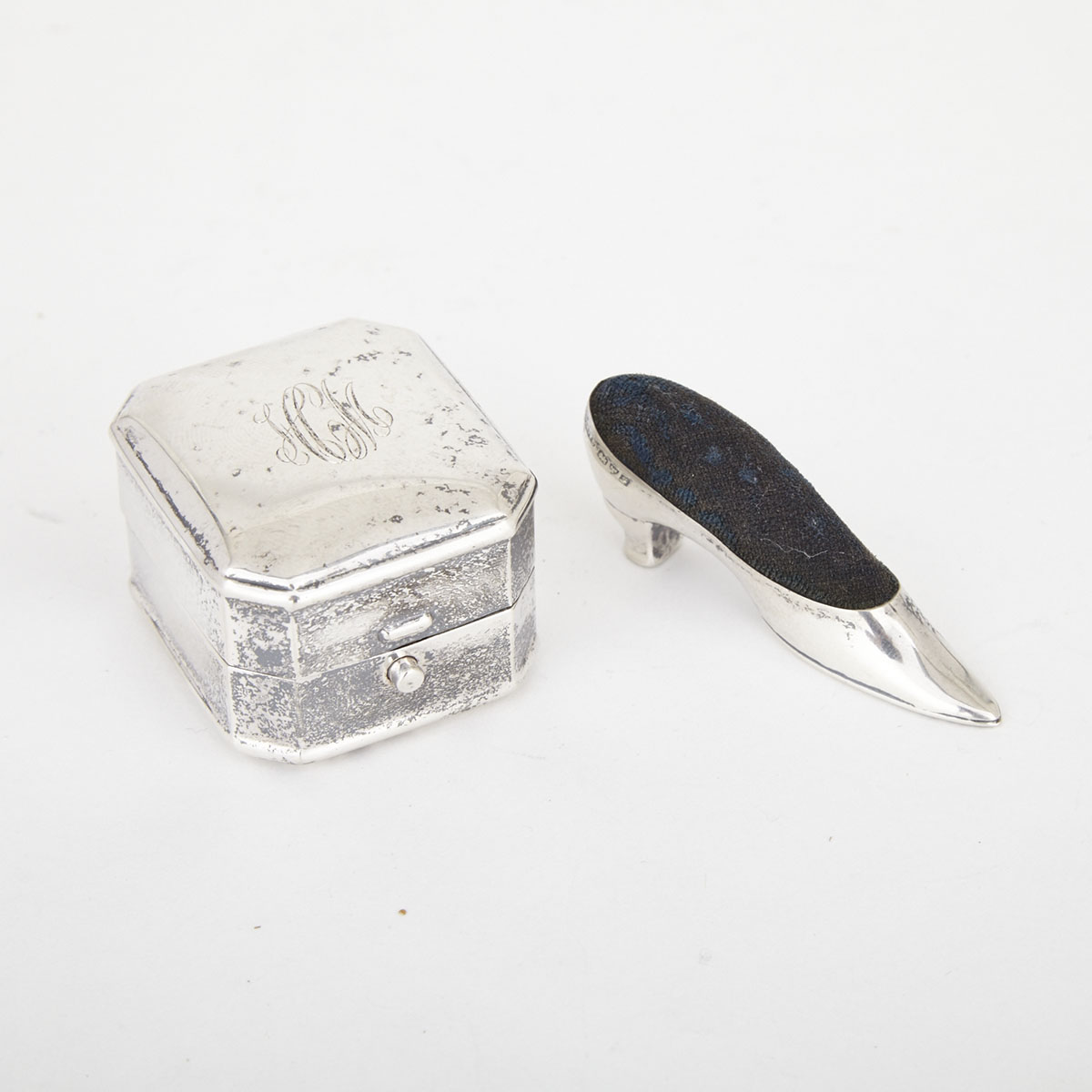 Canadian Silver Ring Box, Henry Birks & Sons, Montreal, Que., 20th century and an Edwardian Silver Mounted Shoe Pin Cushion, Cornelius Saunders & Frank Shepherd, Chester, 1906