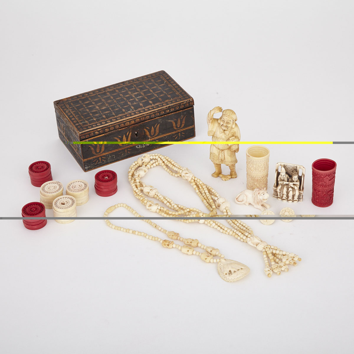A Box with a Collection of Ivory Pieces, 19th Century and Later