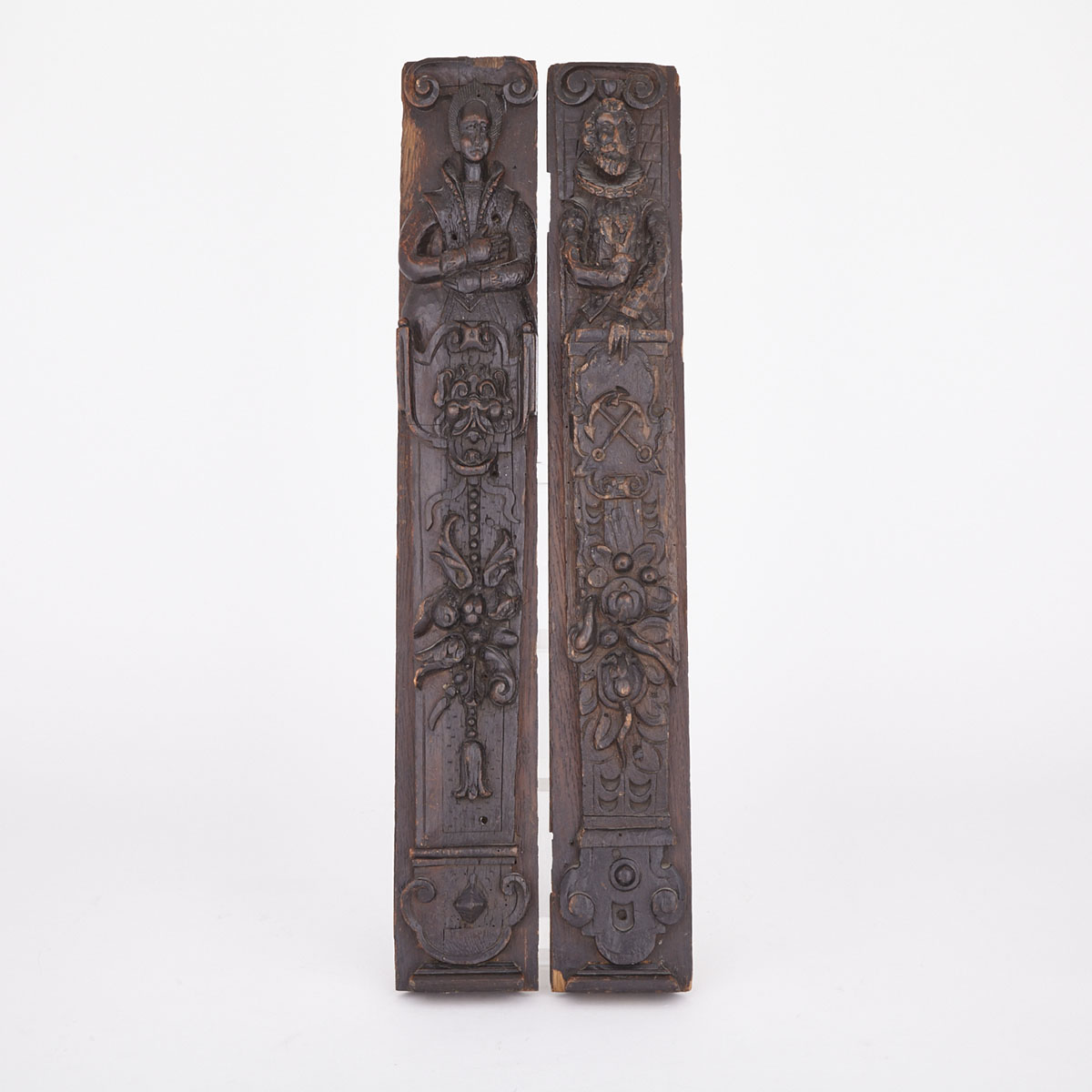 Pair of Victorian Renaissance Style Carved Oak Figural Stiles, 19th century