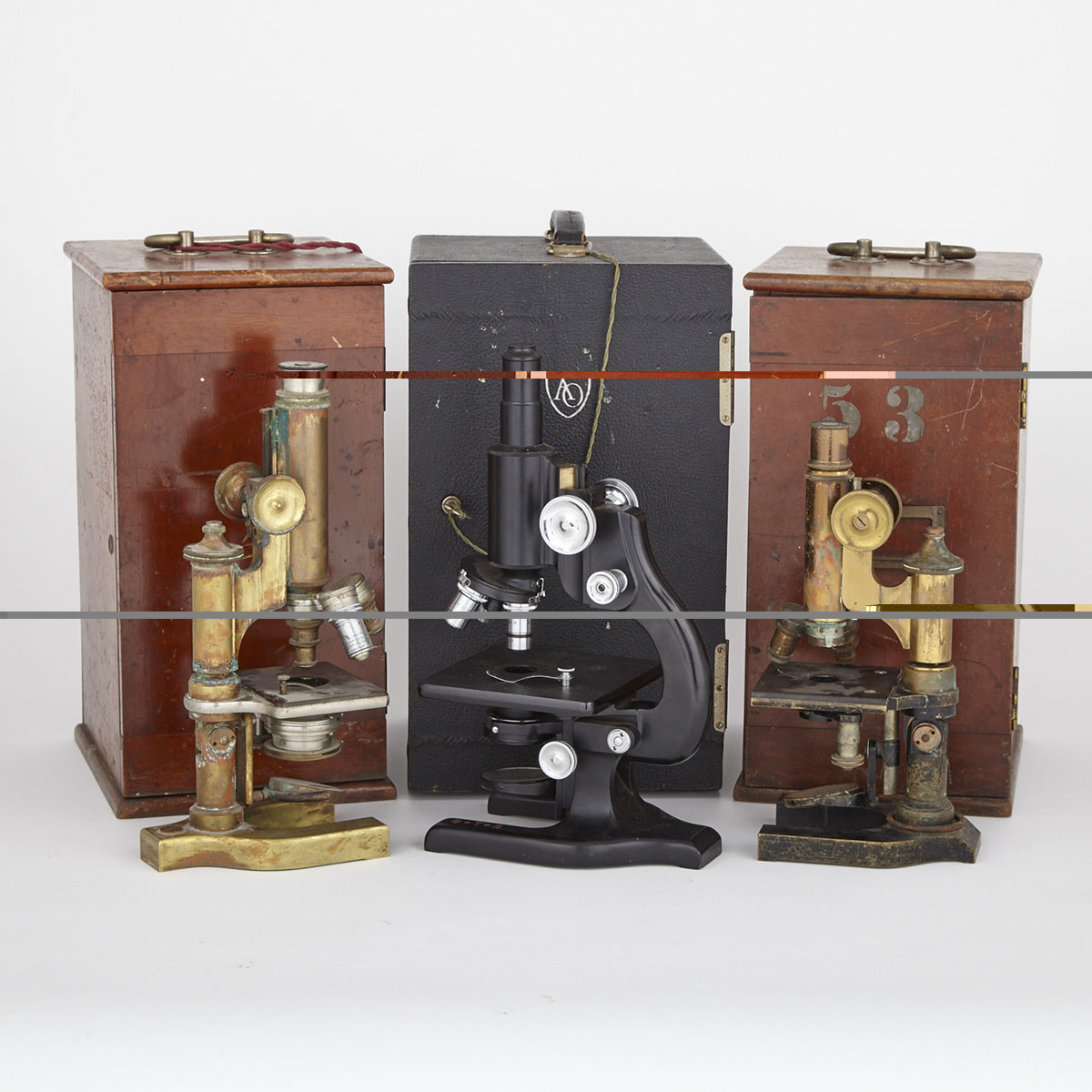 Group of Three Compound Microscopes, Ernst Leitz and Bausch and Lomb, and American Optical Company (Spencer), early 20th century