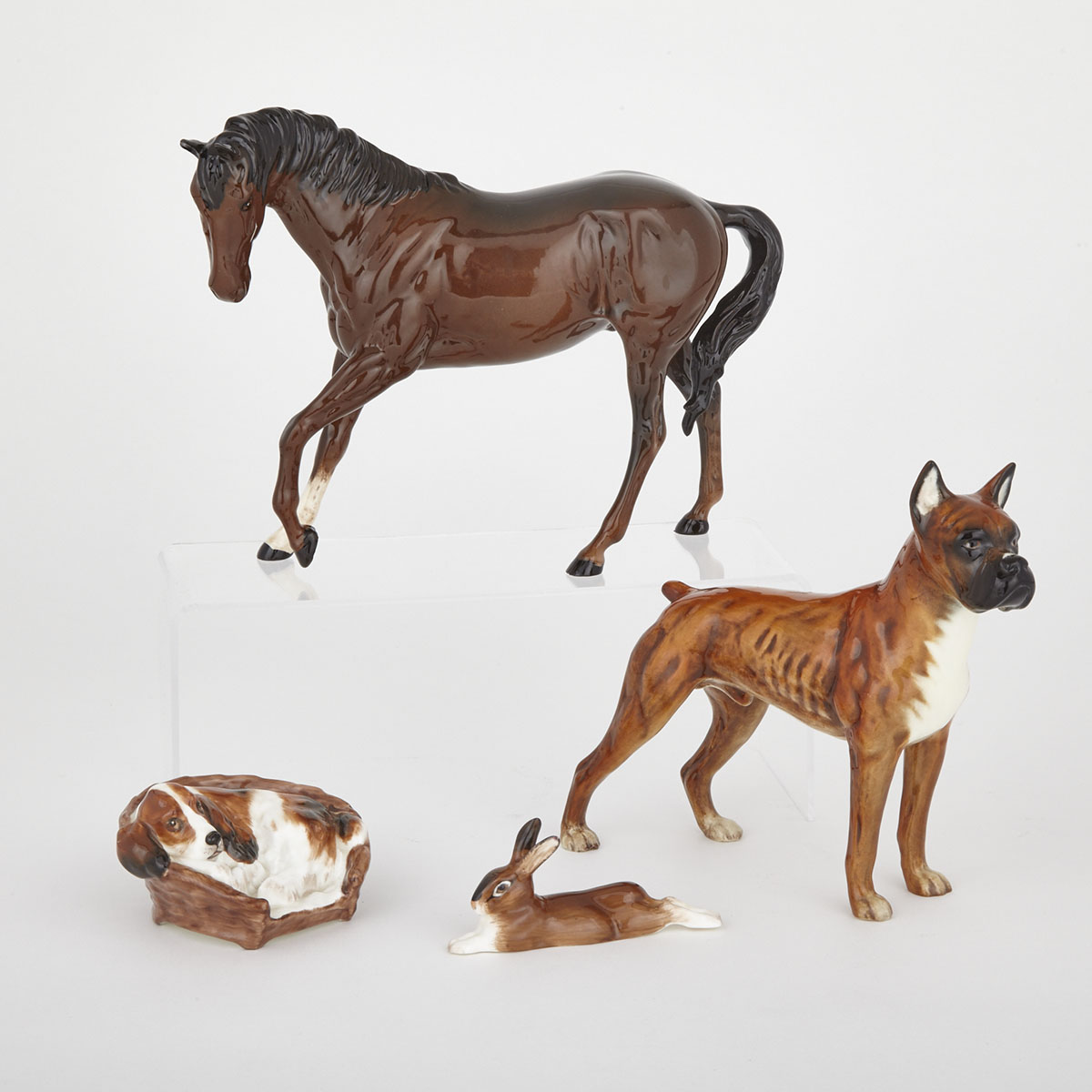 Royal Doulton Horse, Cocker Spaniel in a Basket and a Hare, together with a Goebel Boxer, 20th century