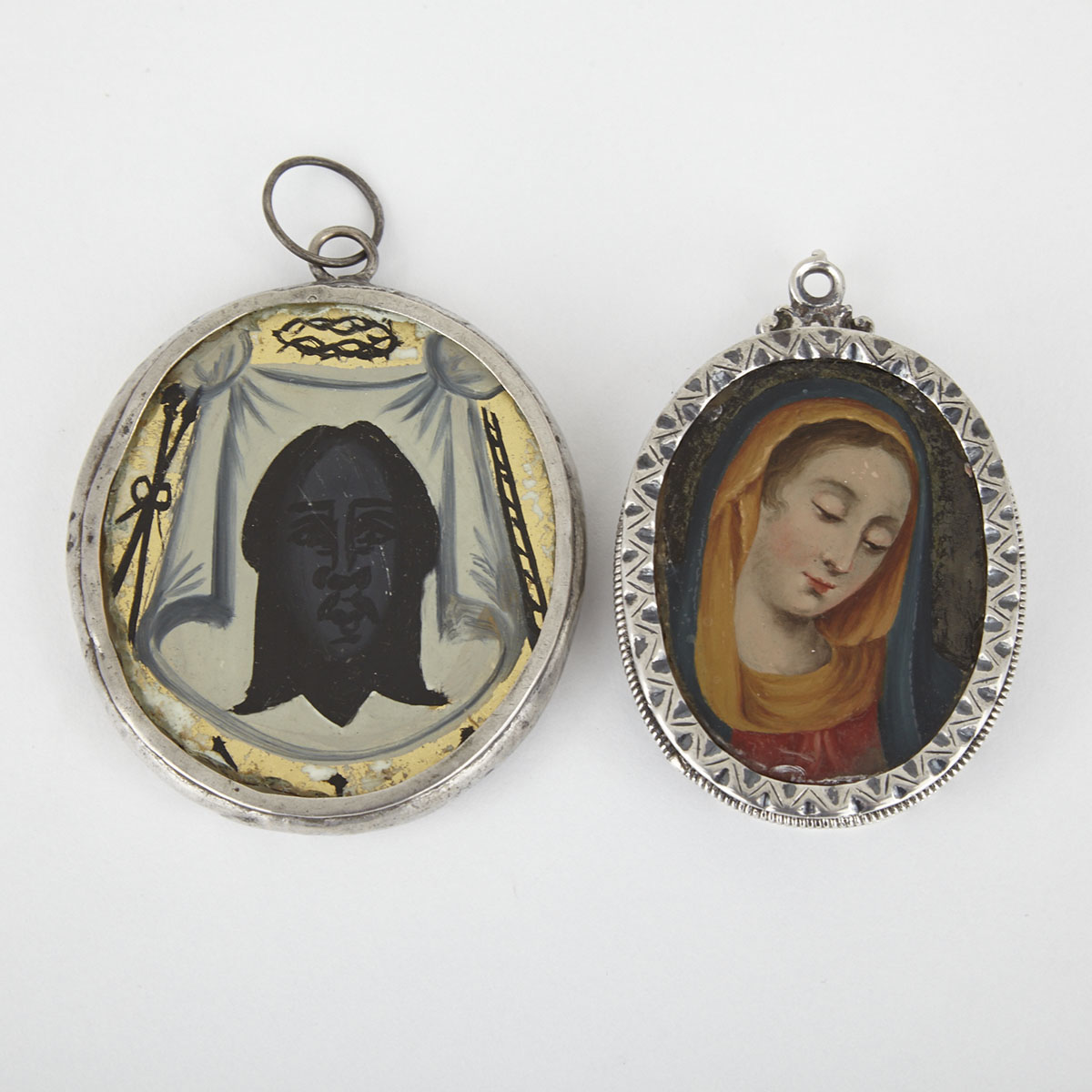 Two Spanish Provincial Silver and Reverse Painting on Glass Double Sided Pendent Icons, c.1860