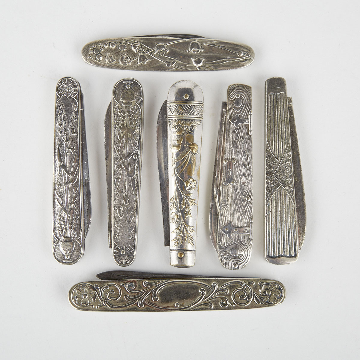 Seven American Silver Plated Pocket Knives, late 19th century