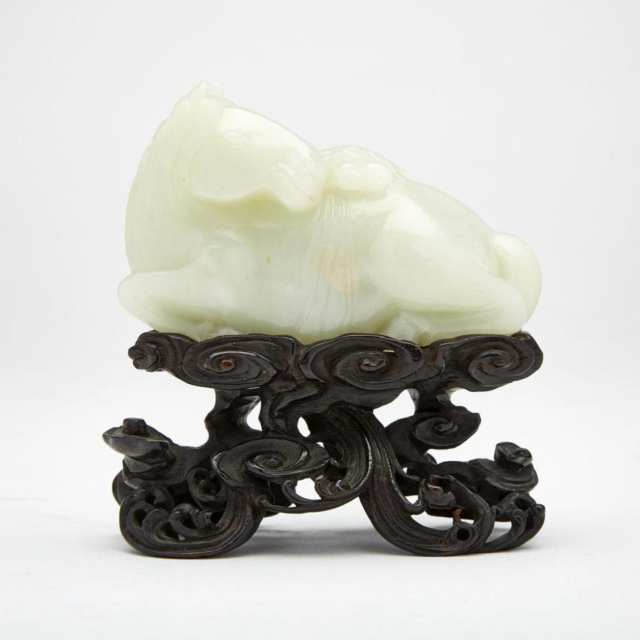 A Celadon White Jade Horse with Zitan Rosewood Reticulated Stand, Qianlong Period, 18th Century